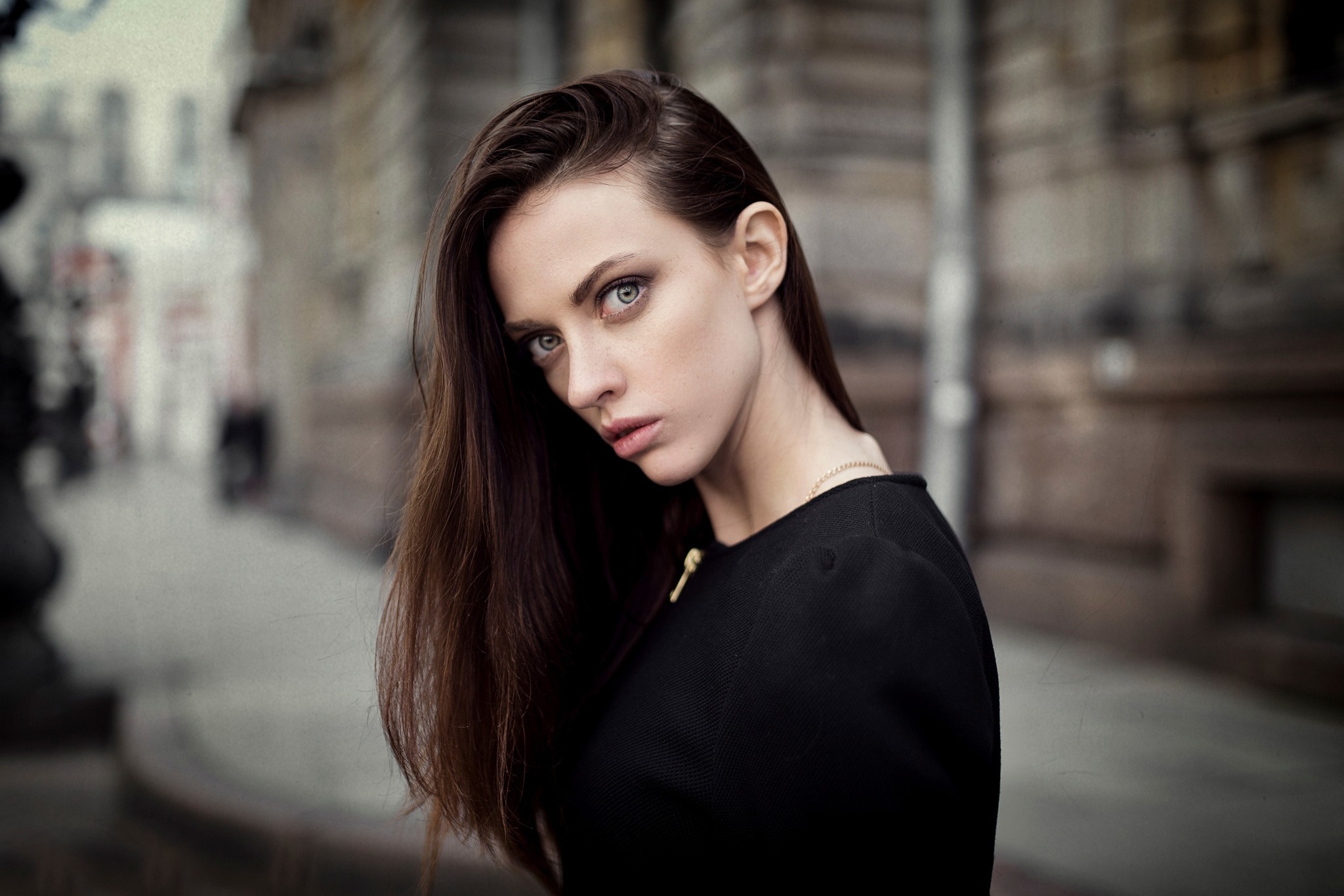 Woman with long brown hair in black top HD Wallpaper