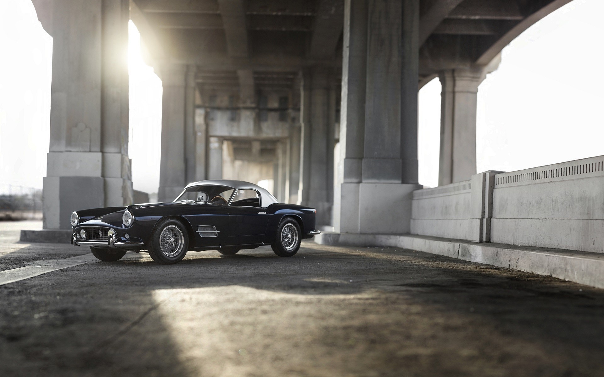 Dark blue Ferrari 250 GT California Spyder under a bridge HD Wallpaper