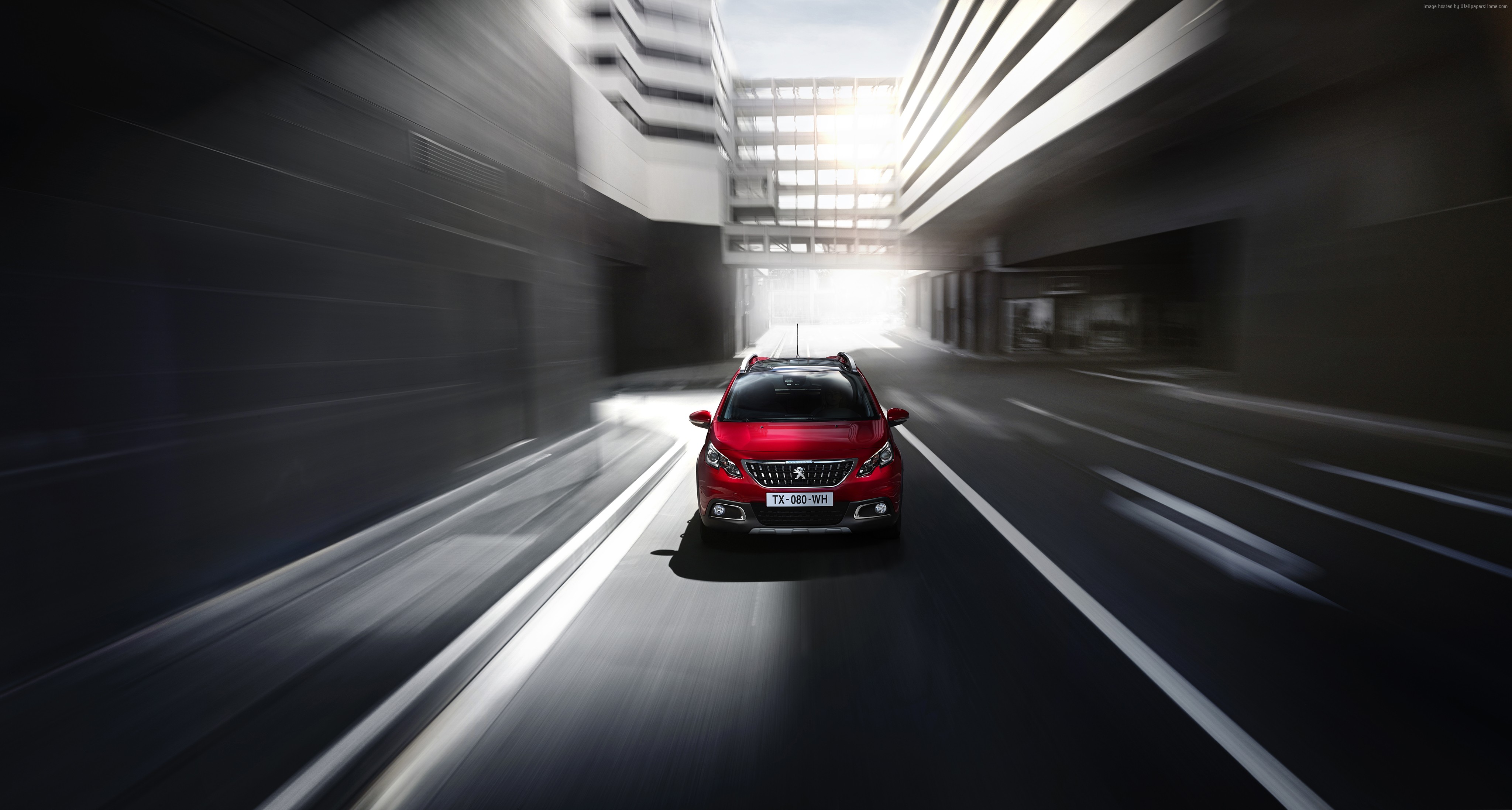 Red Peugeot 2008 crossover driving through city HD Wallpaper