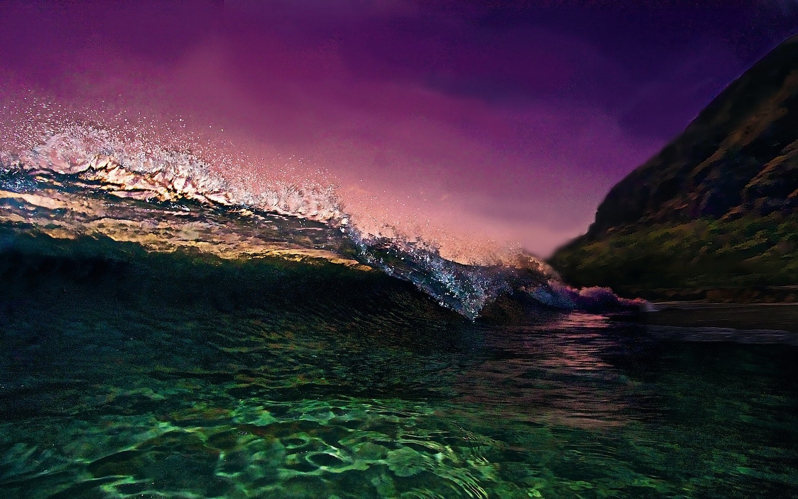 Wave crashing near a mountain at sunset HD Wallpaper