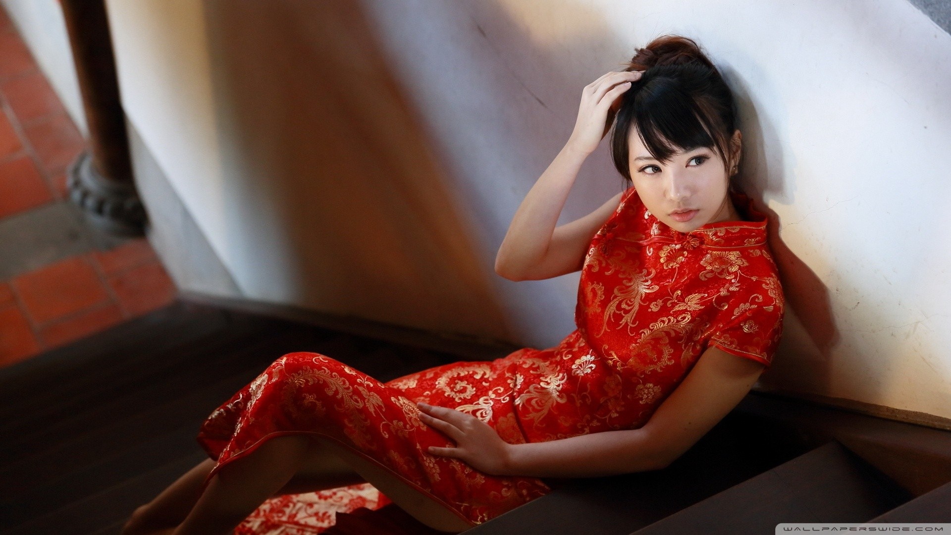 Woman in red dress sitting on stairs HD Wallpaper