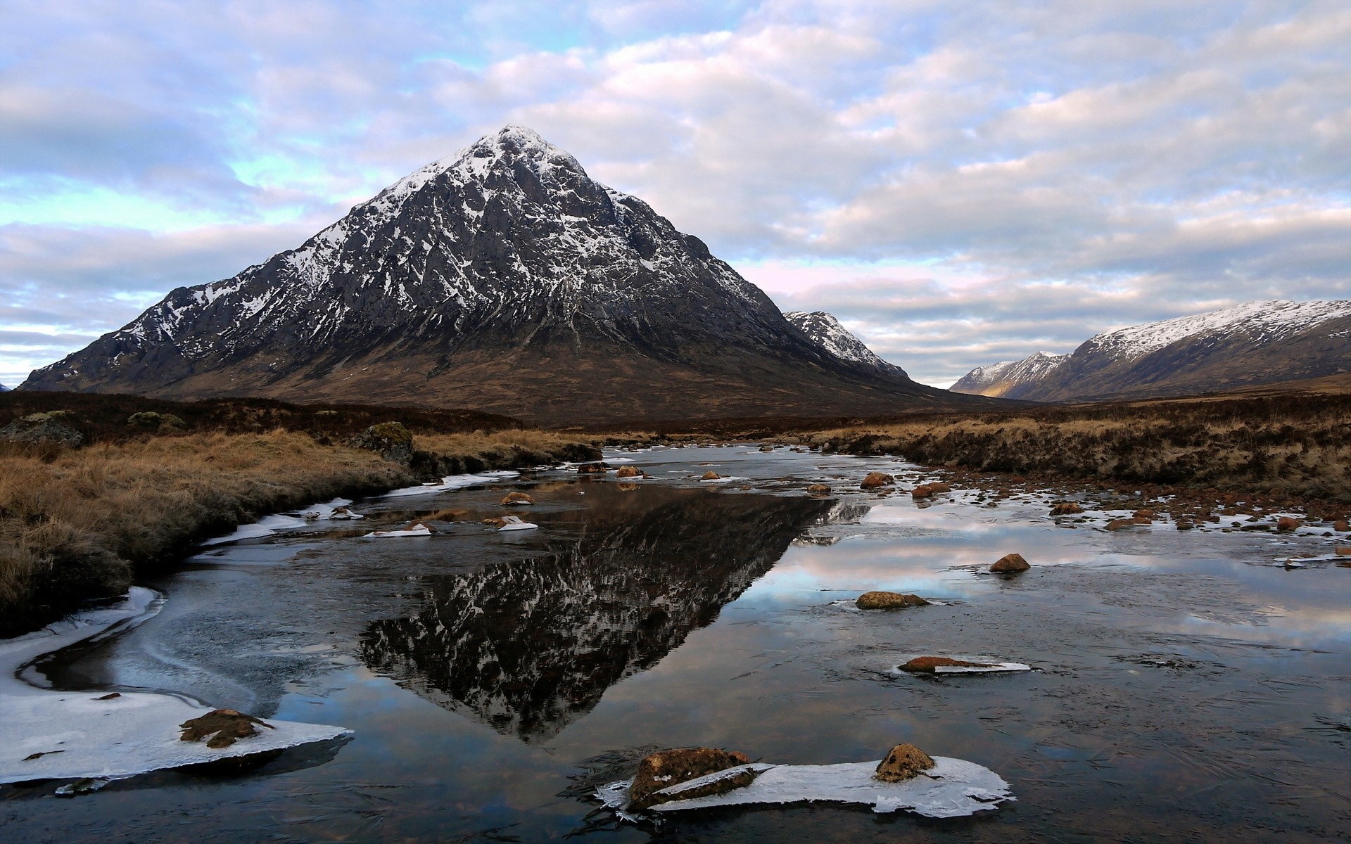 Snow-capped mountain reflected in a frozen river HD Wallpaper
