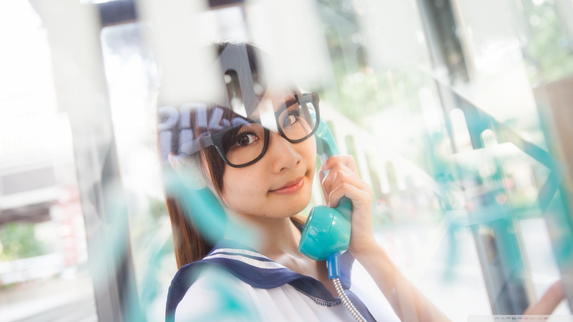 Asian woman wearing glasses and school uniform holding a phone HD Wallpaper