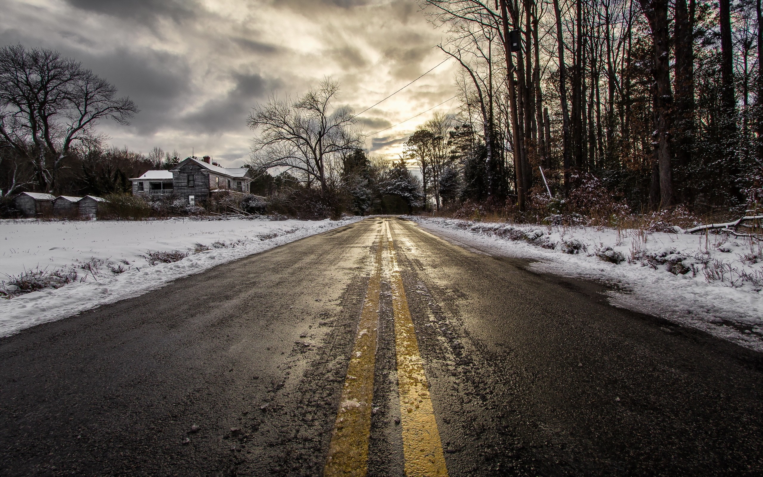 Abandoned house on a snowy road in winter HD Wallpaper
