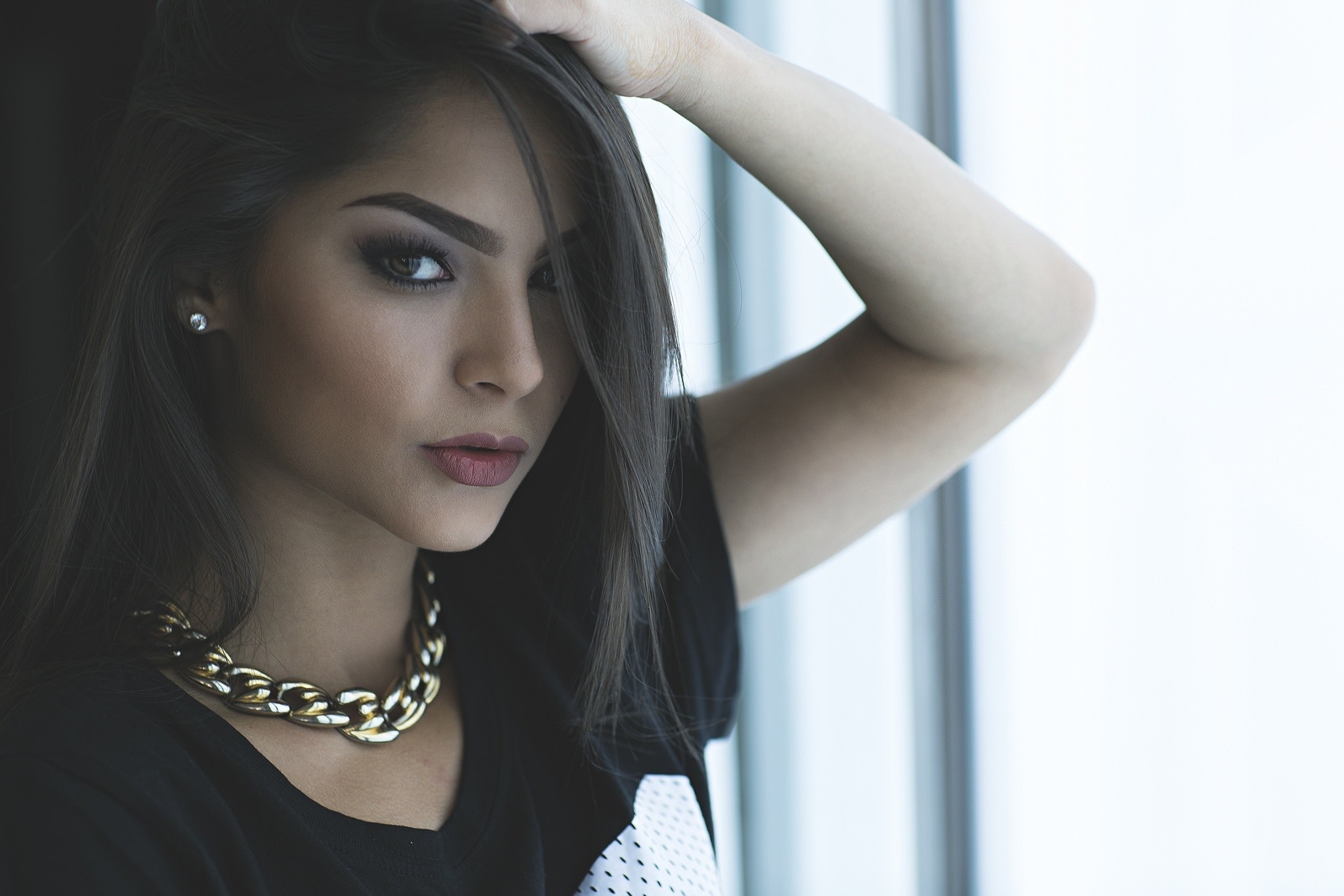 Woman with dark hair and gold necklace HD Wallpaper
