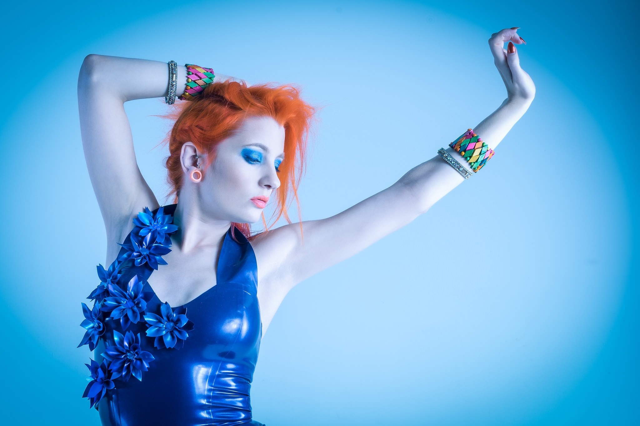 Woman with orange hair in blue latex costume HD Wallpaper
