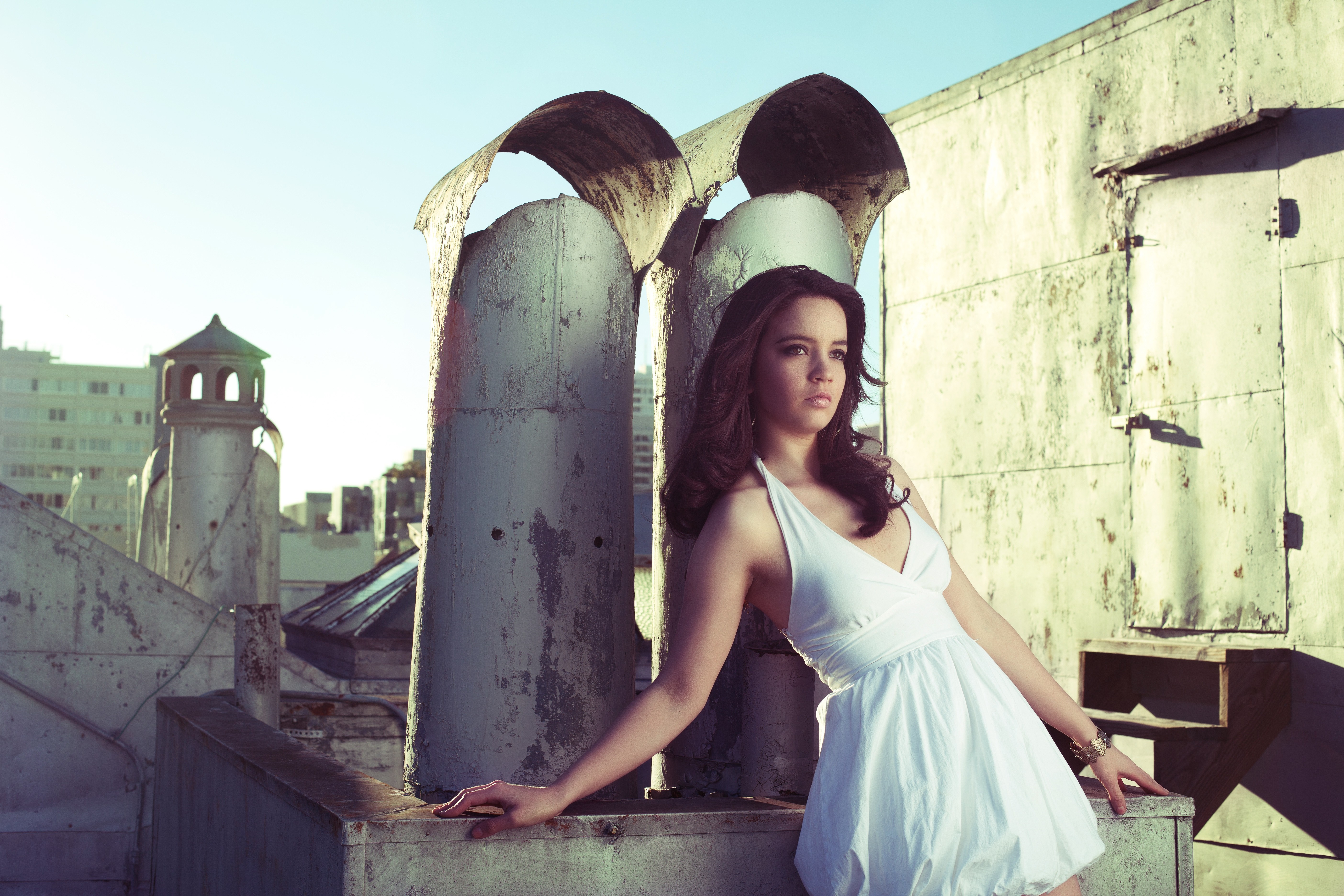 Woman in white dress on a rooftop HD Wallpaper