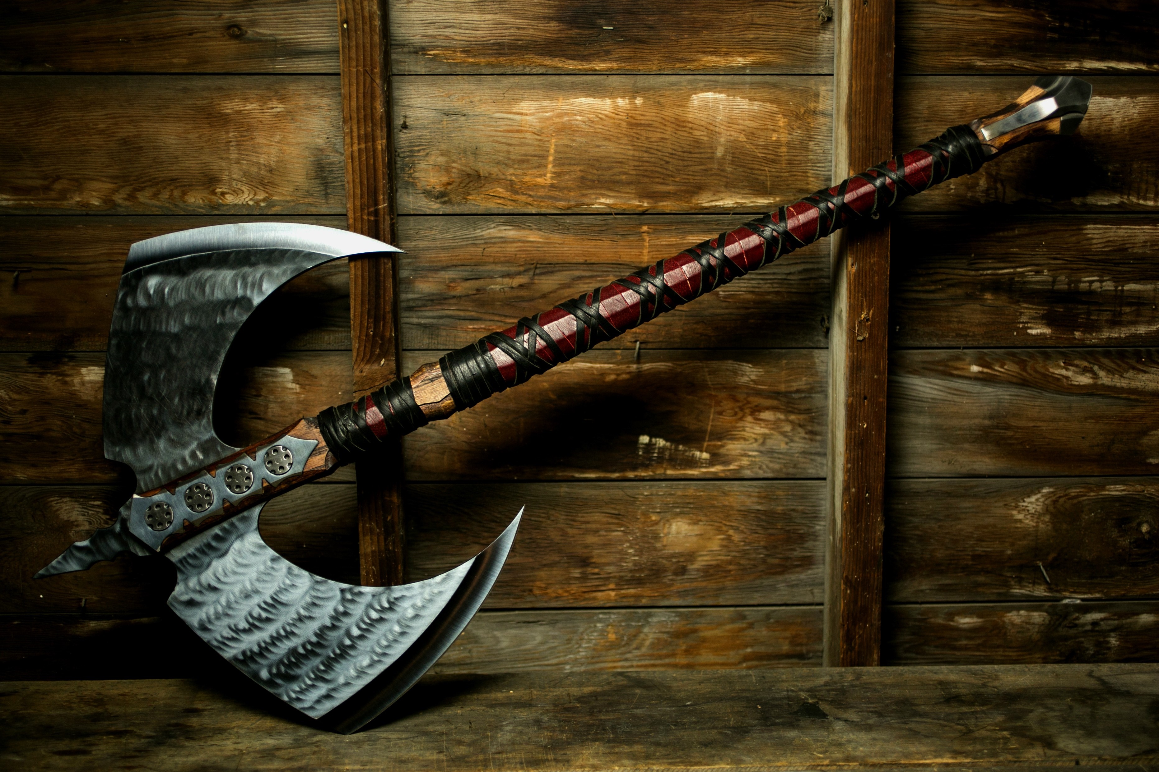 Double-headed axe with leather-wrapped handle HD Wallpaper