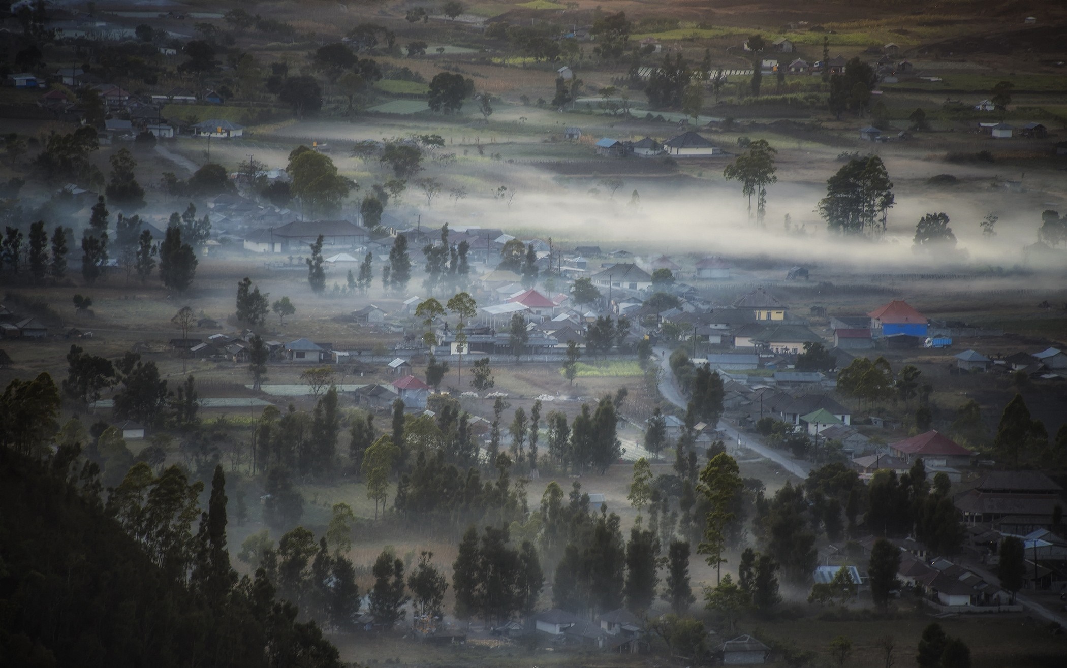 Misty village in a valley at sunrise HD Wallpaper