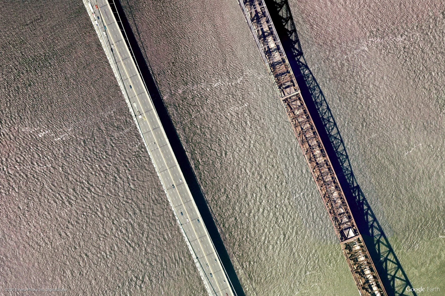 Aerial view of two bridges over water HD Wallpaper