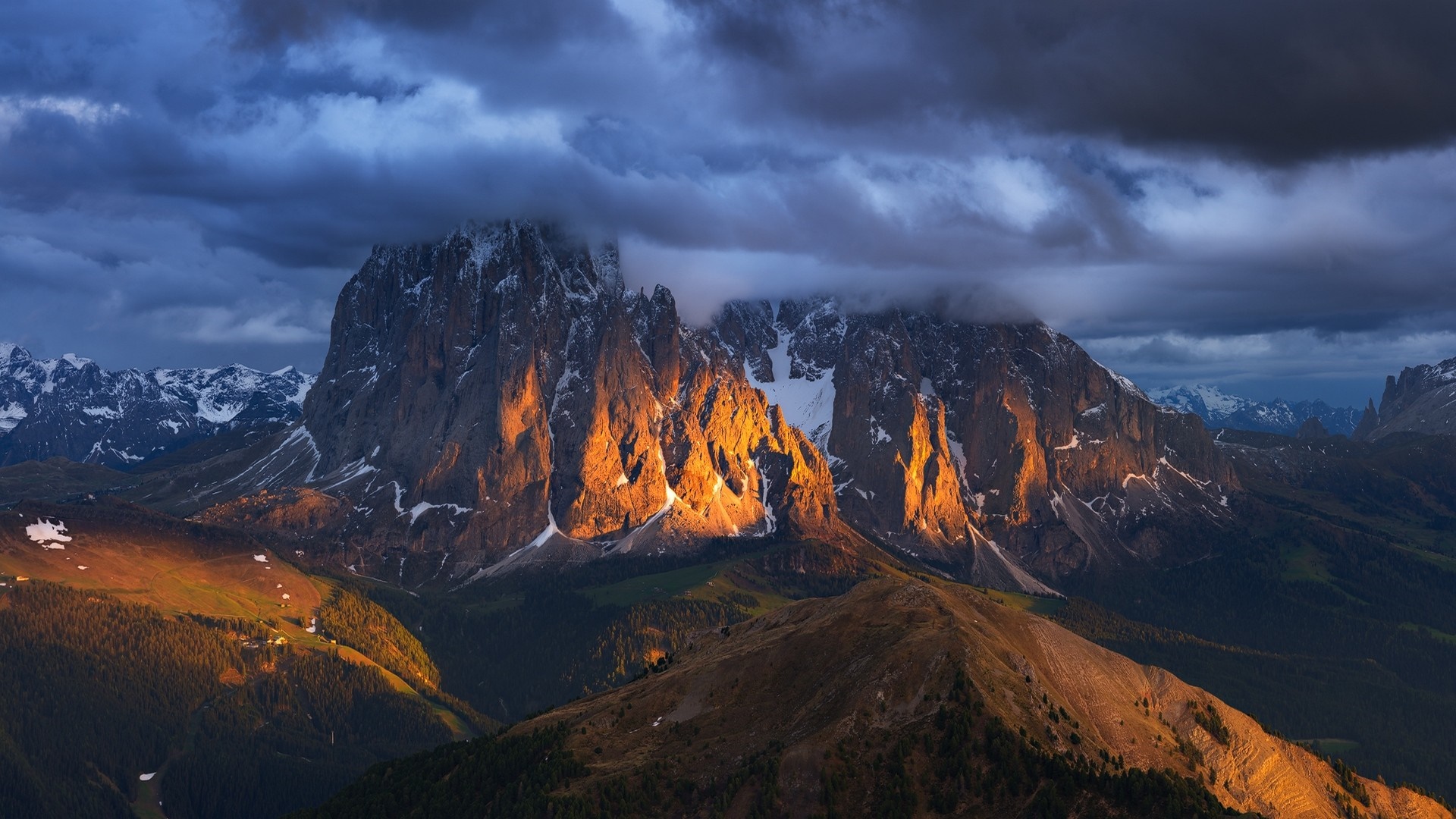 Golden hour illuminates jagged peaks in the Italian Alps HD Wallpaper