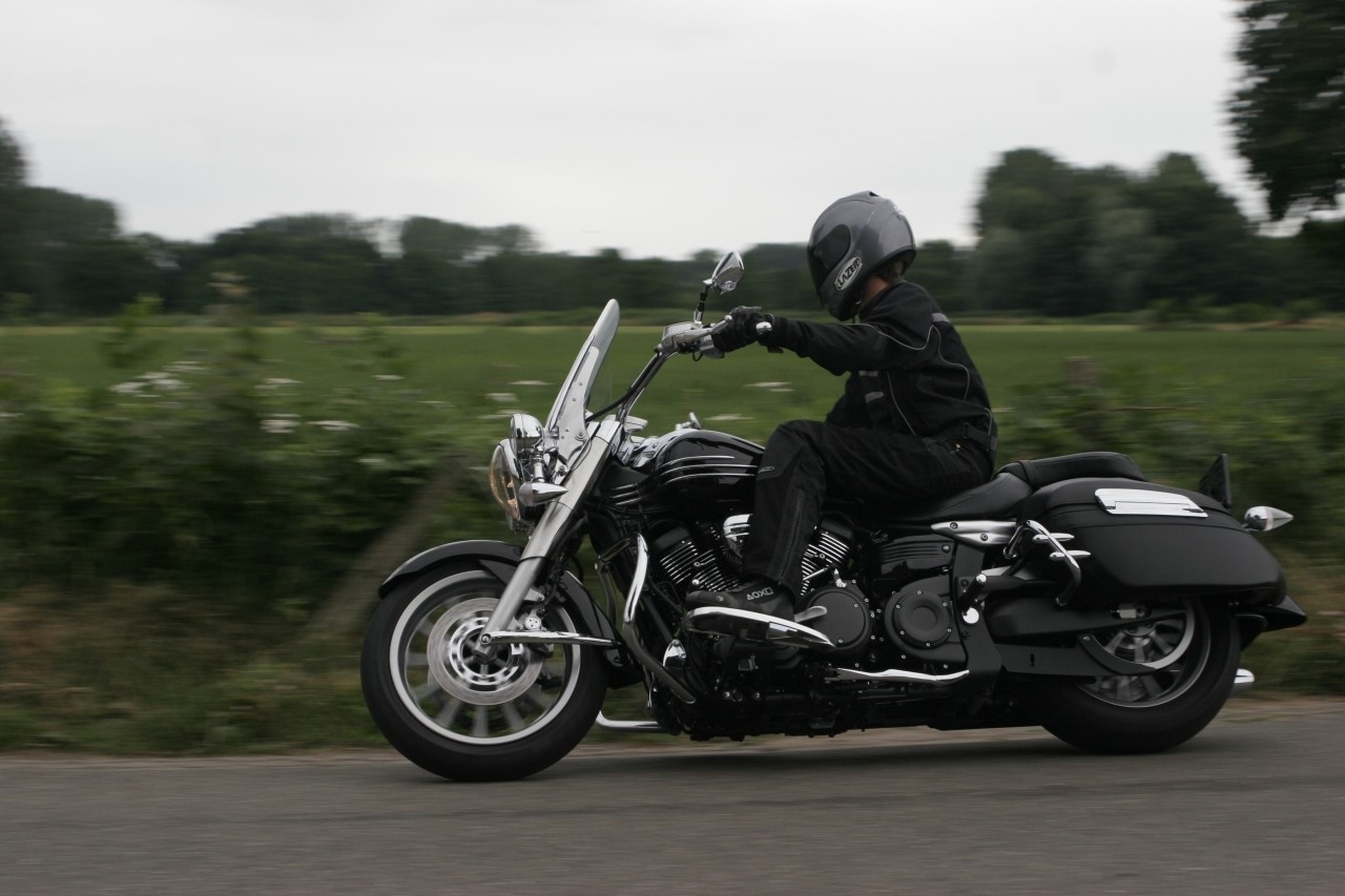Rider on a black Yamaha XV 1900 motorcycle HD Wallpaper