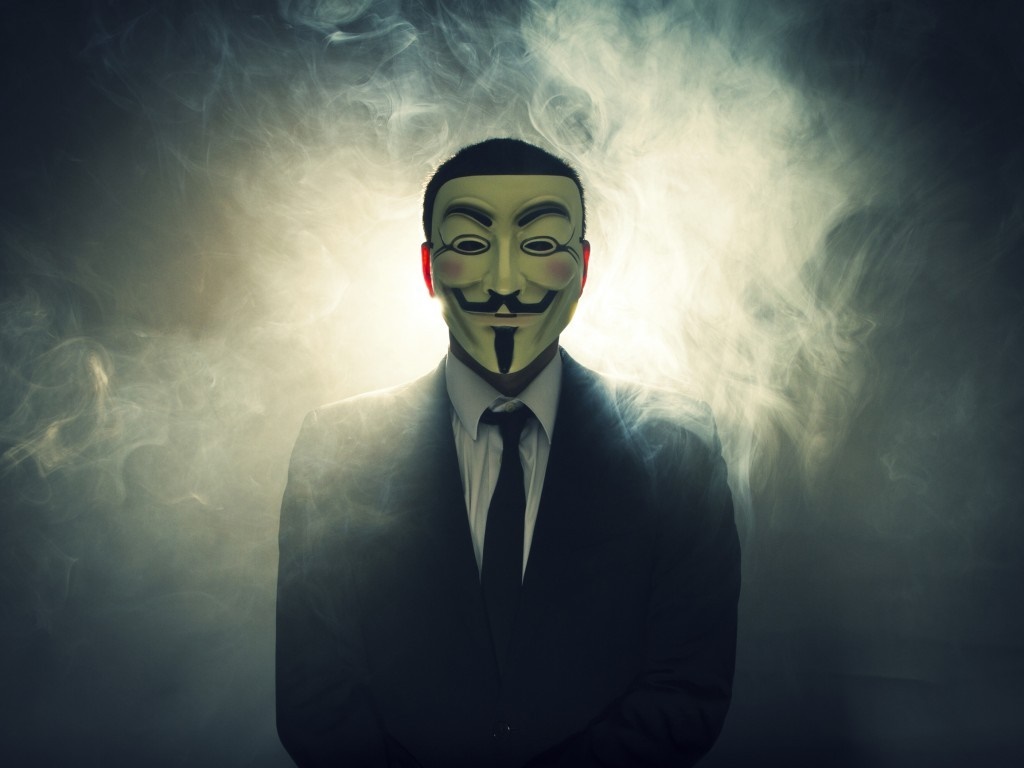 Man in Guy Fawkes mask and suit with smoke HD Wallpaper