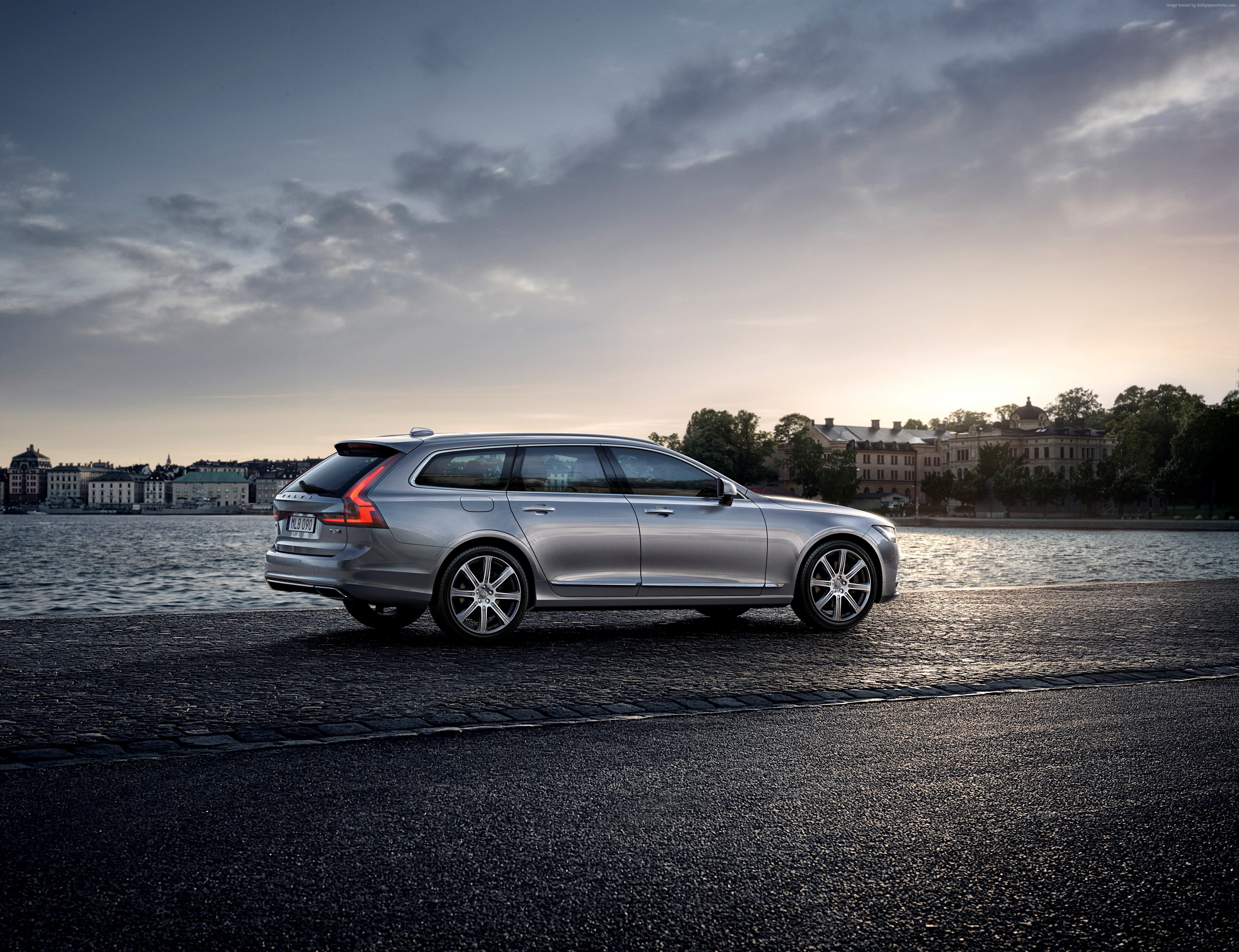 Grey Volvo V90 station wagon parked by water HD Wallpaper