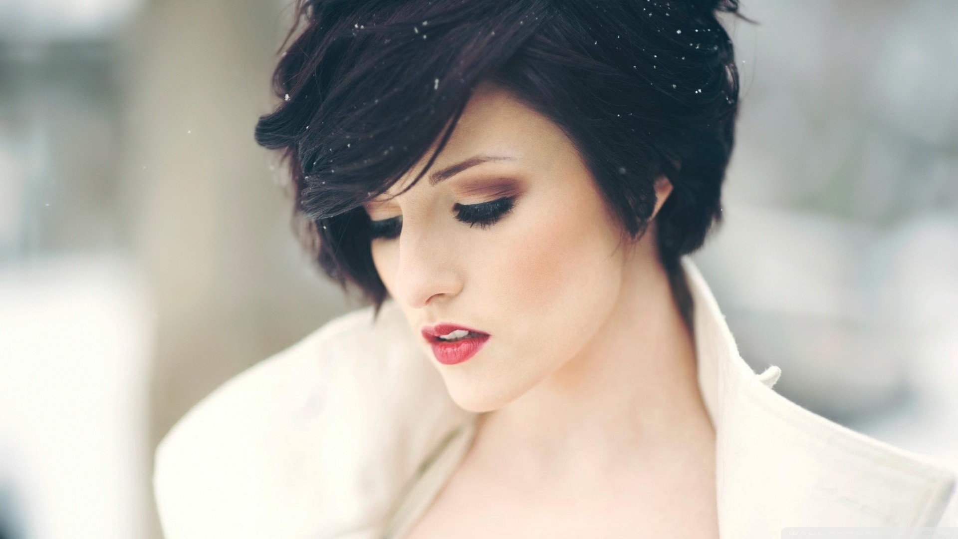 Elegant Woman with Short Dark Hair in Snow HD Wallpaper