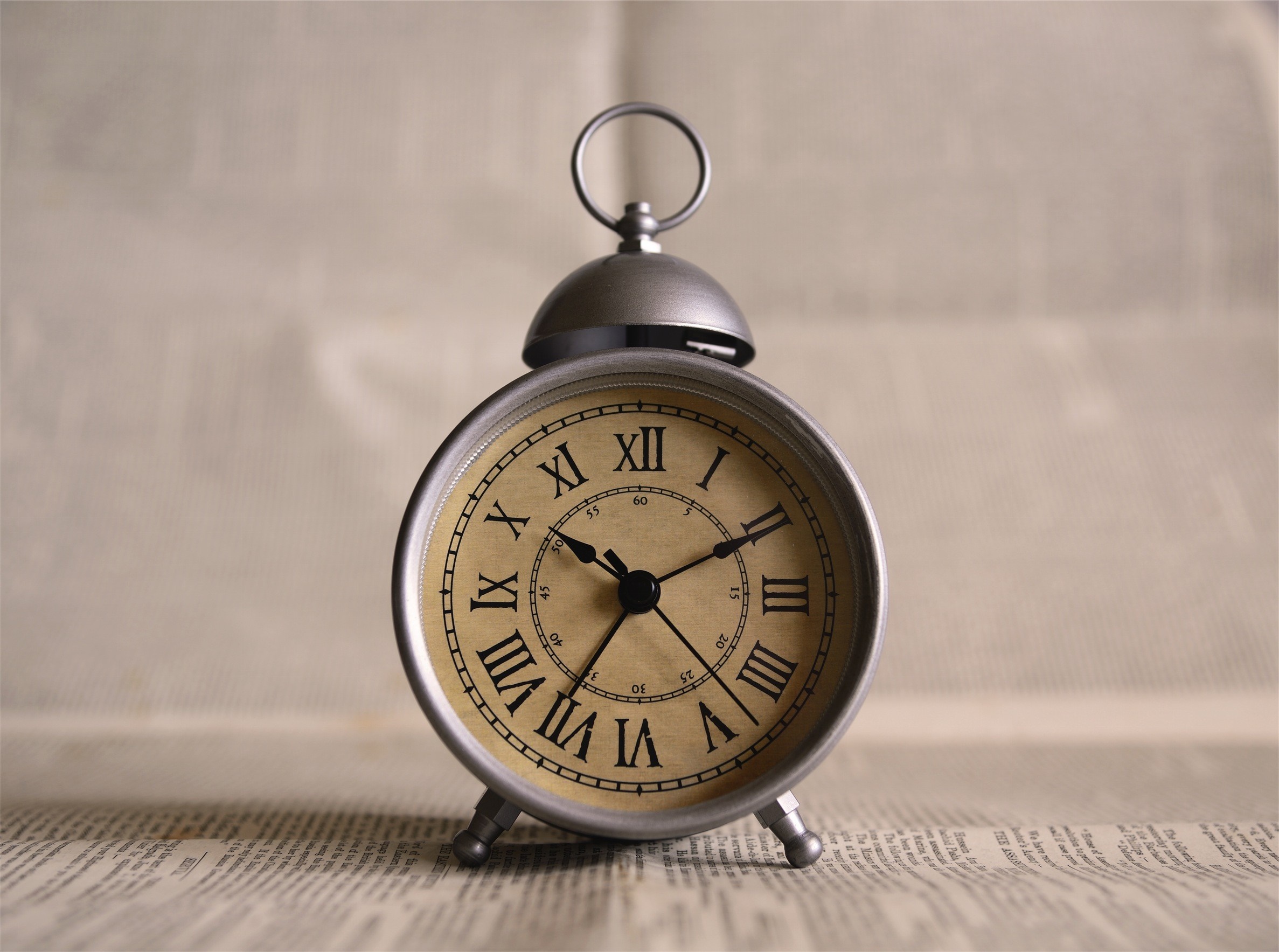 Vintage alarm clock with Roman numerals HD Wallpaper