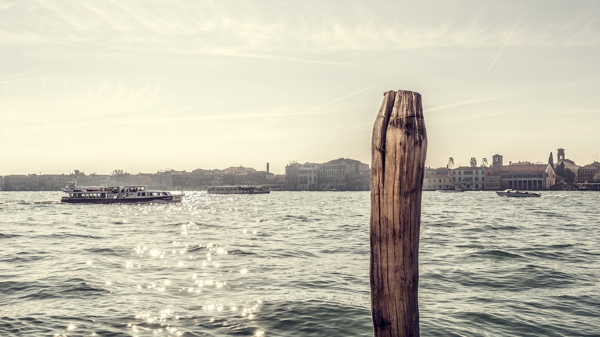 Venice canal with boats and buildings HD Wallpaper