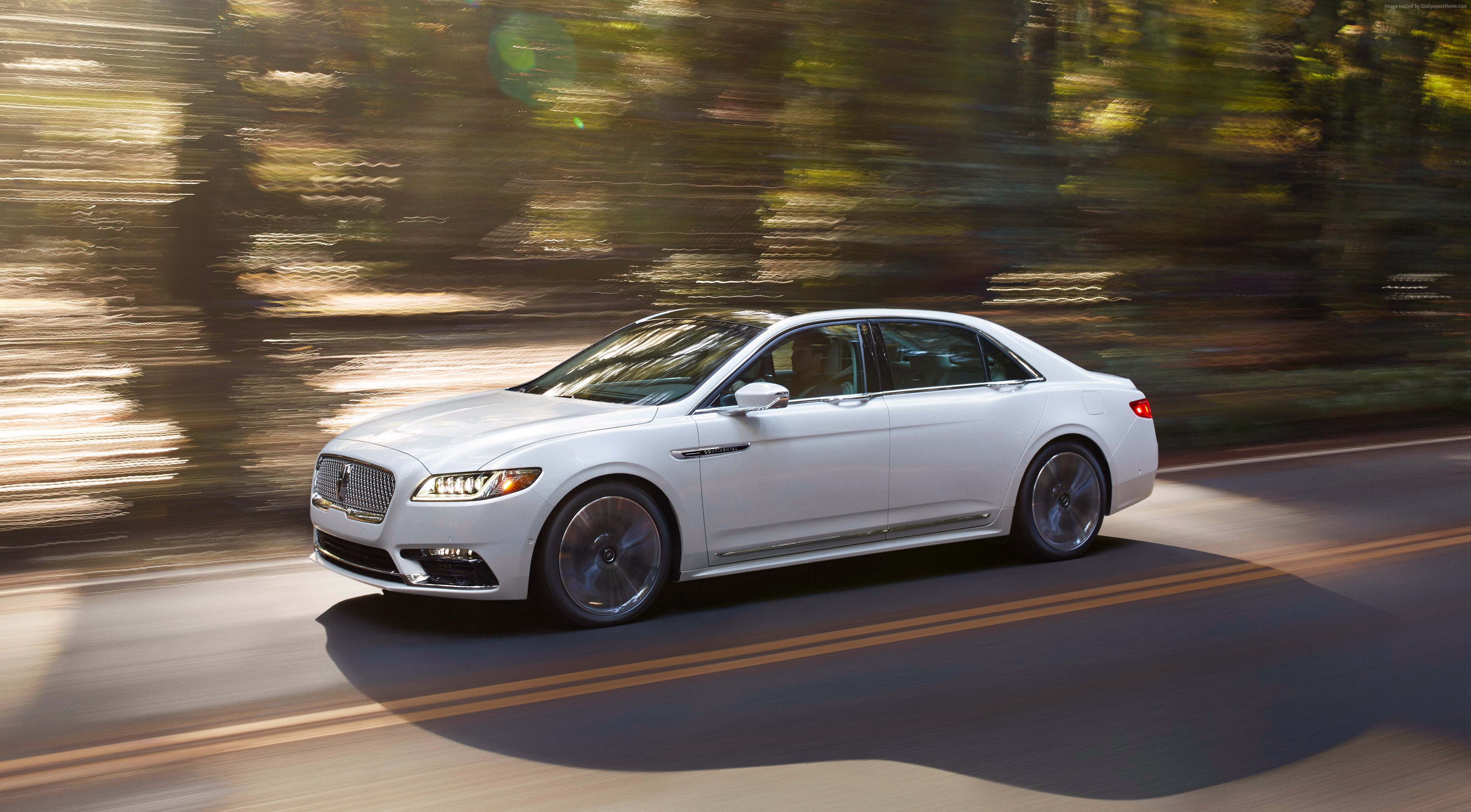 White Lincoln Continental driving on a road HD Wallpaper