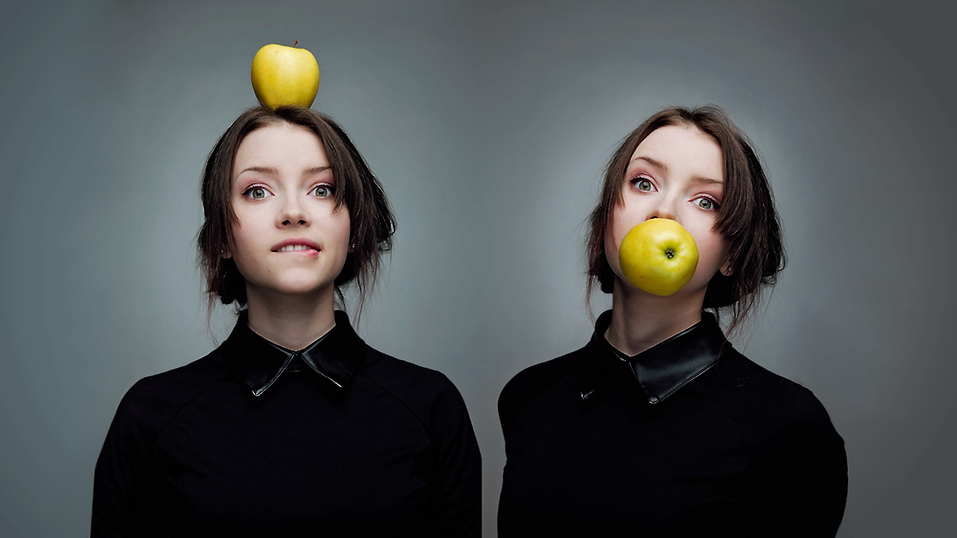 Two women with apples, one on head, one in mouth HD Wallpaper
