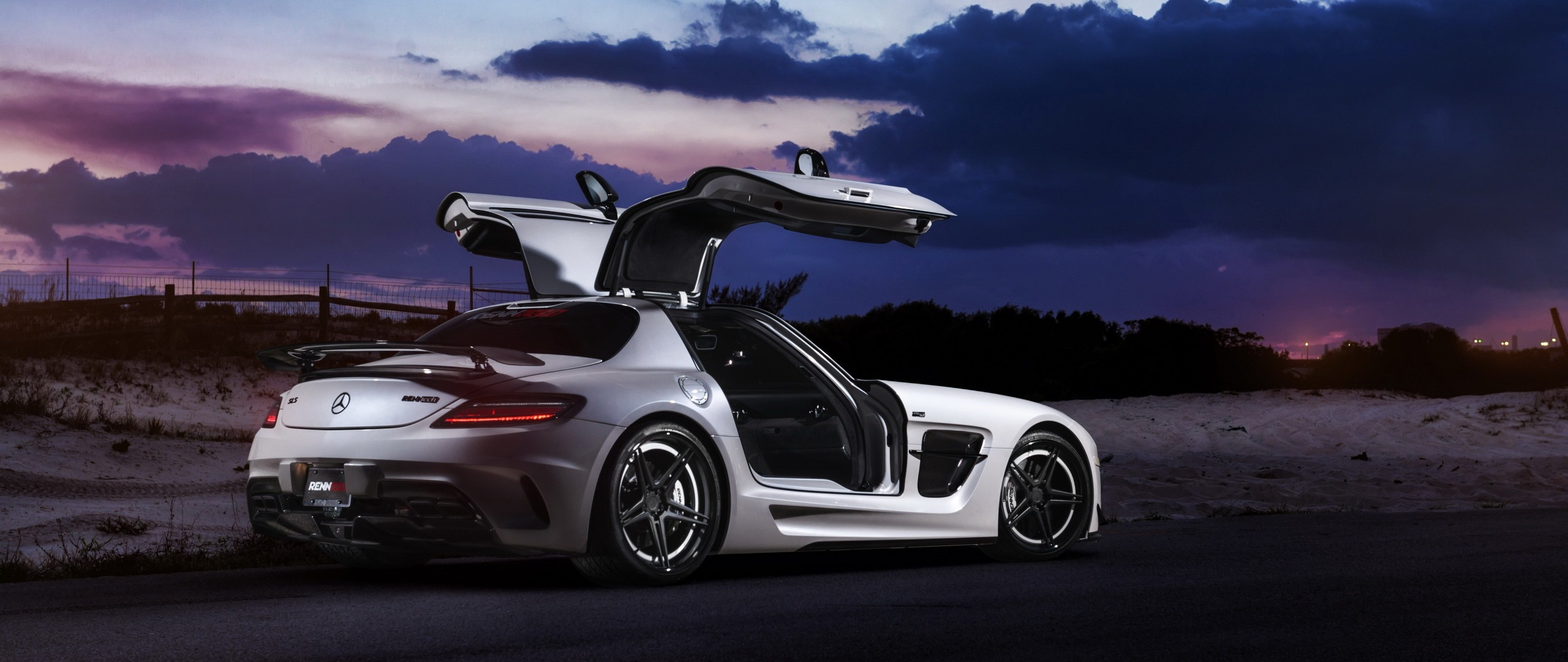 White Mercedes-Benz SLS AMG with Gullwing Doors at Dusk HD Wallpaper