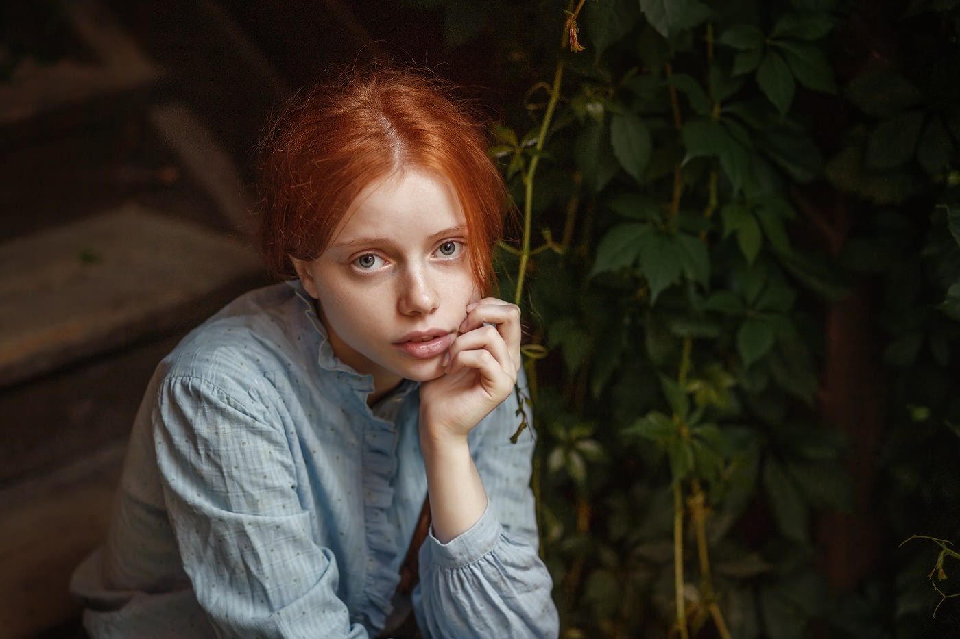 Young redhead woman sitting on steps with greenery HD Wallpaper