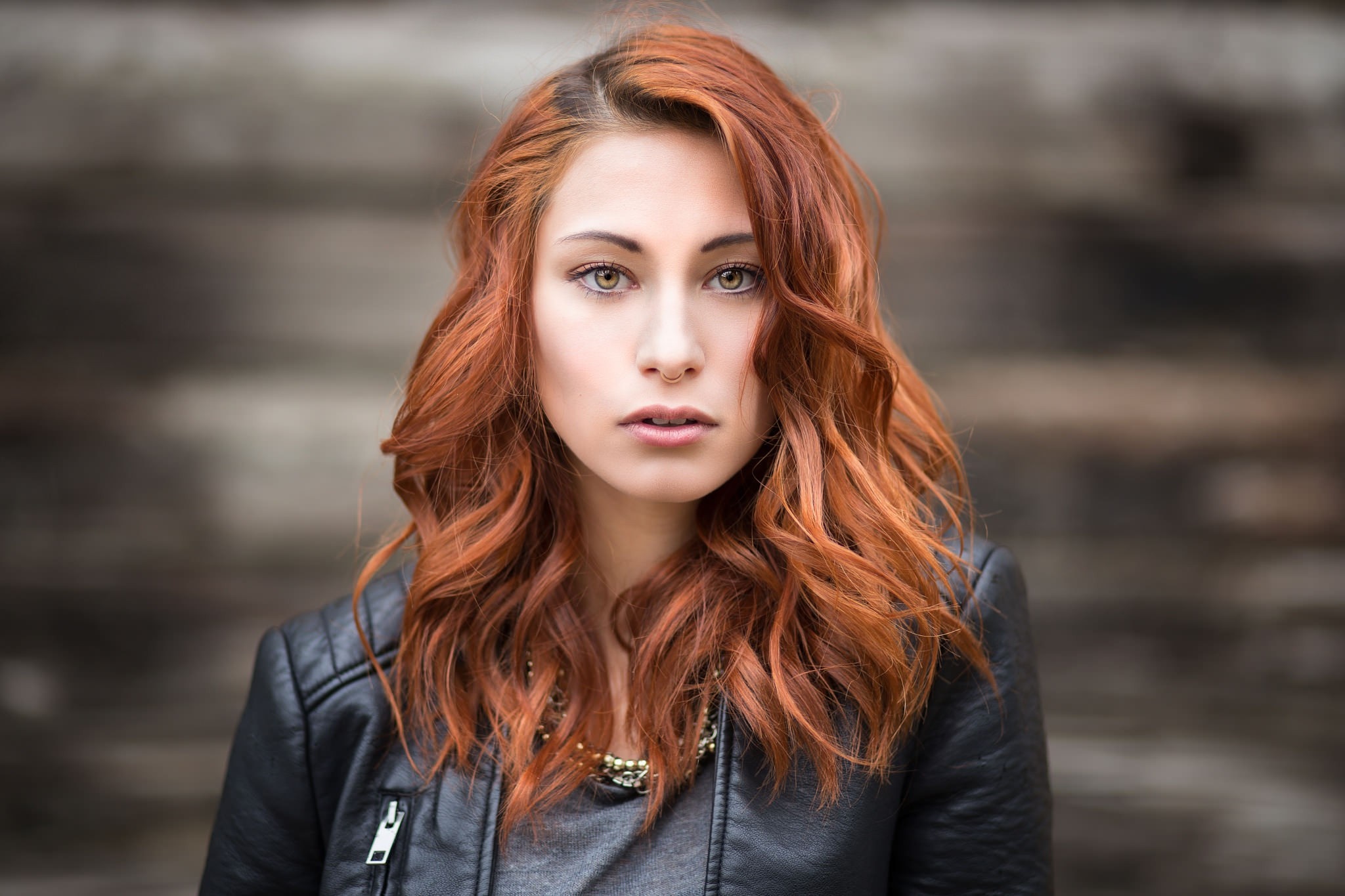 Woman with red hair wearing a leather jacket HD Wallpaper