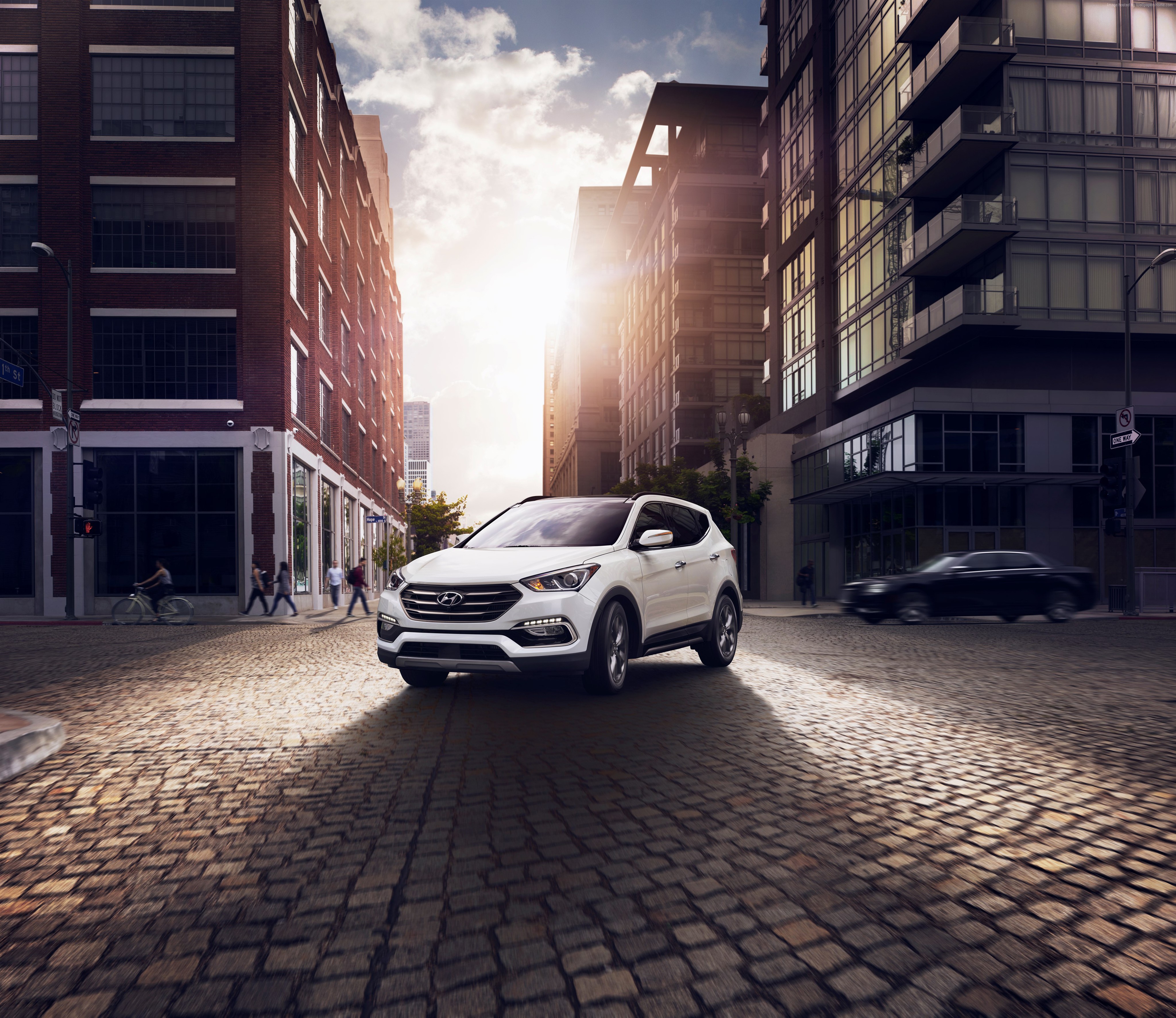 White Hyundai Santa Fe Sport on a cobblestone street HD Wallpaper