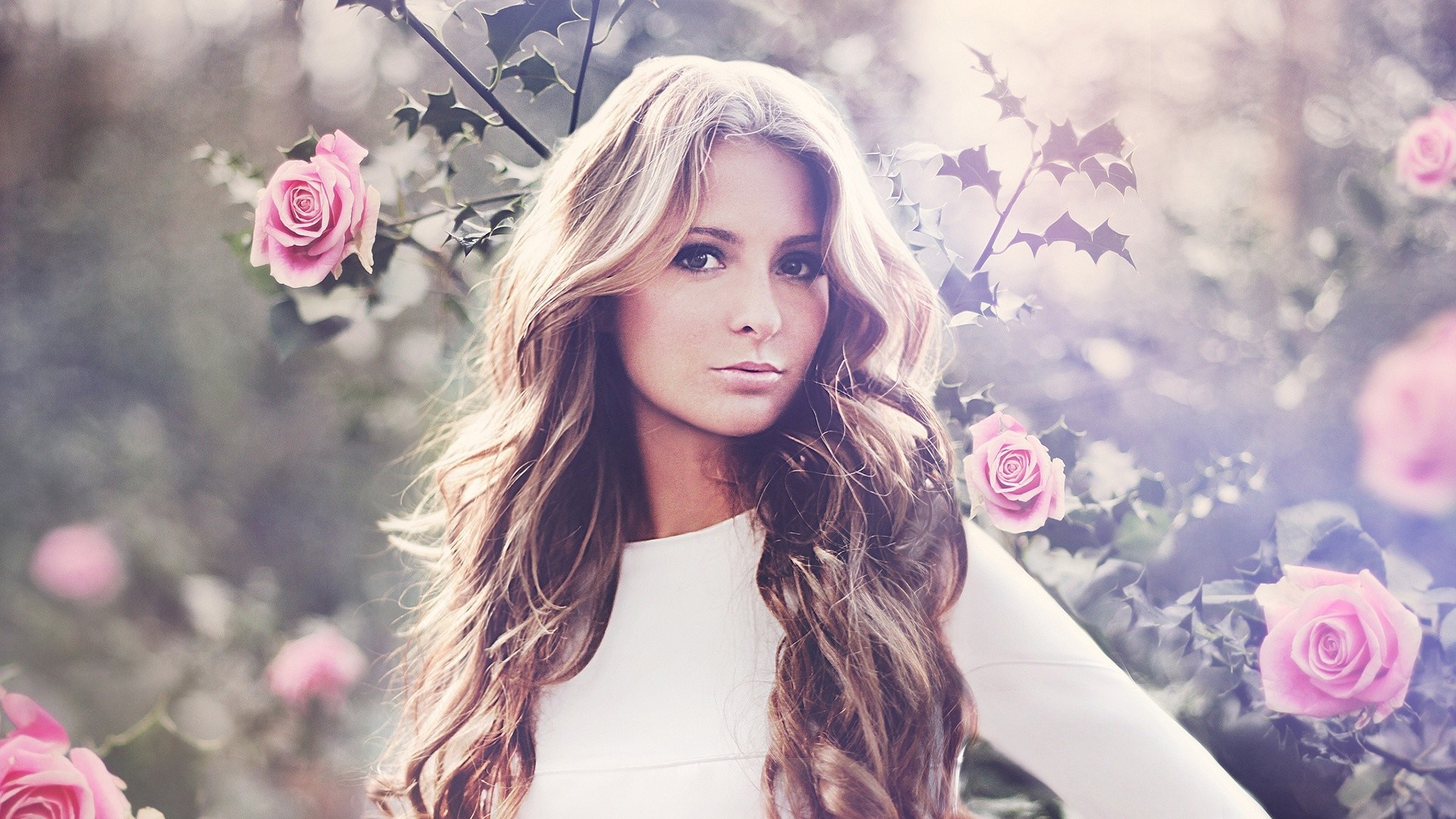 Woman with long wavy hair and pink roses HD Wallpaper