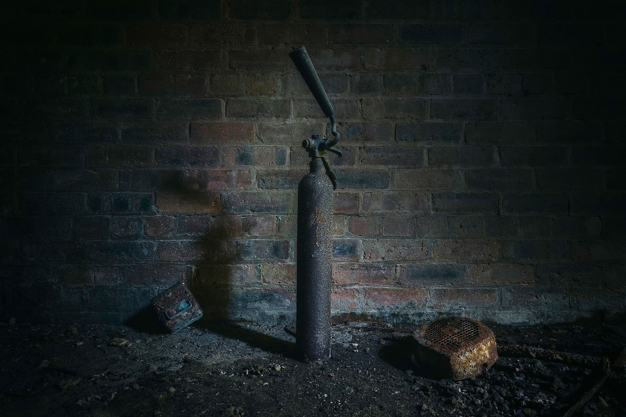 Rusty fire extinguisher against brick wall HD Wallpaper