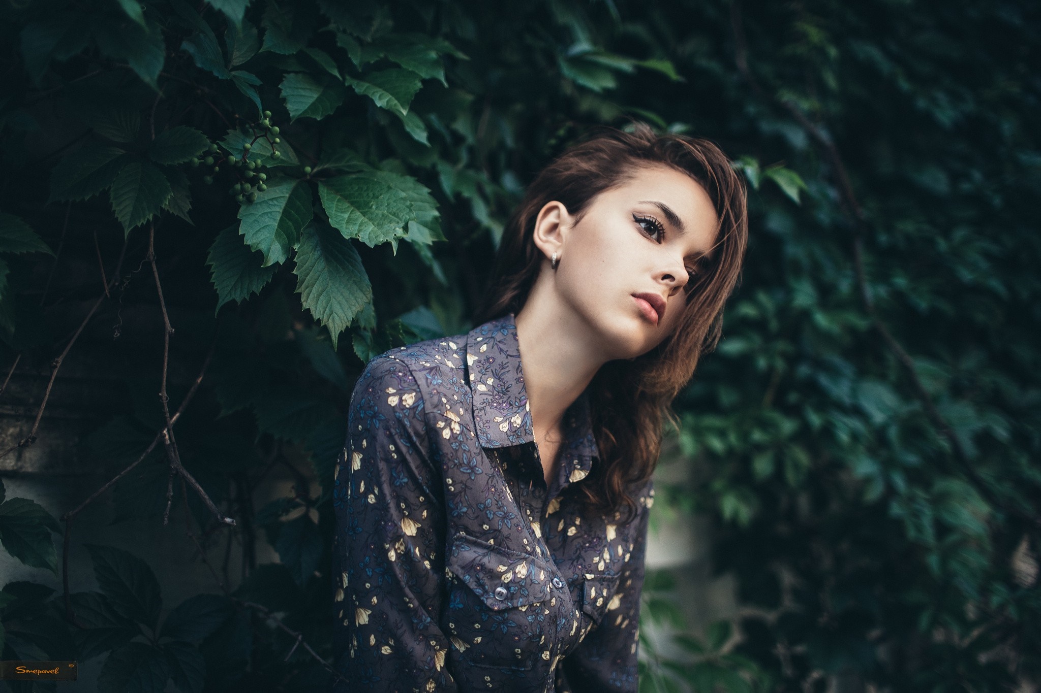 Woman with brunette hair in a floral shirt outdoors HD Wallpaper