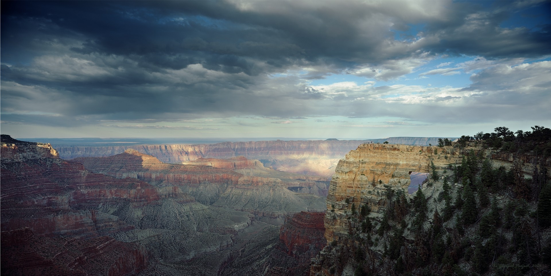 Grand Canyon National Park at sunset with dramatic clouds HD Wallpaper
