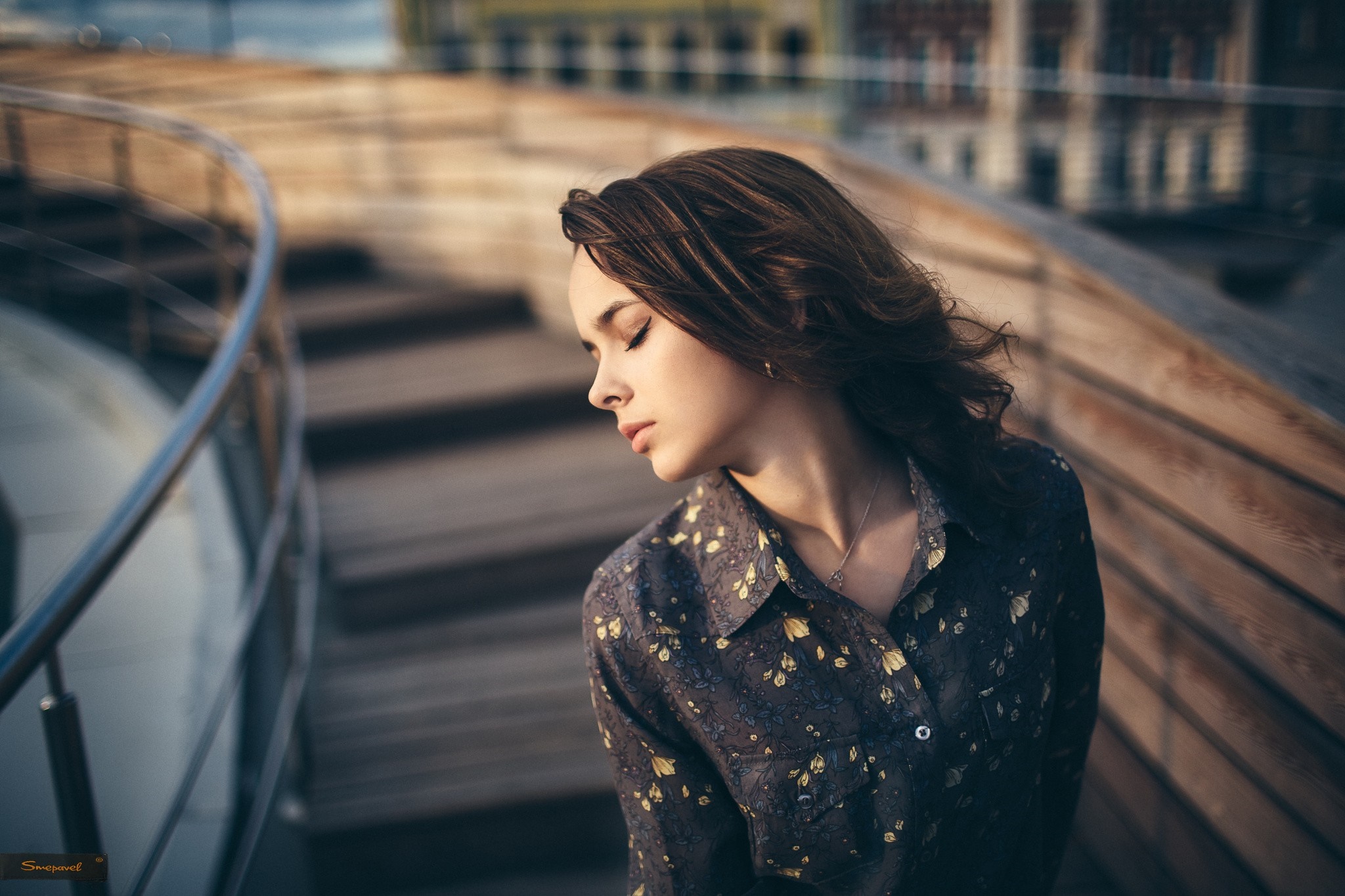 Woman with closed eyes wearing a floral shirt outdoors HD Wallpaper