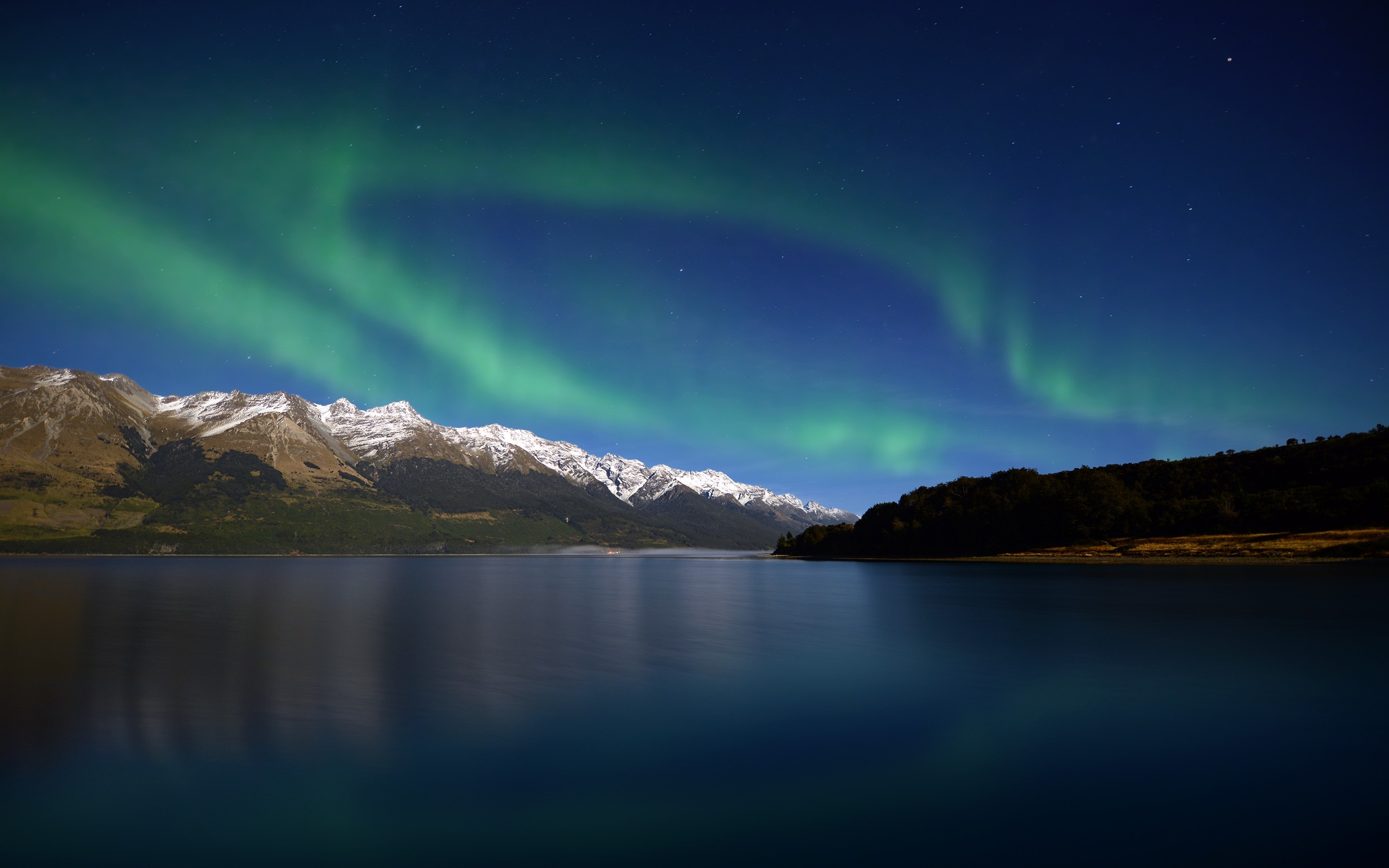 Aurora Borealis over snow-capped mountains and lake at night HD Wallpaper
