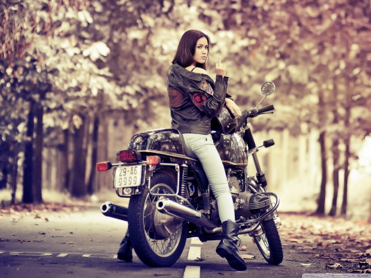 Woman on a motorcycle giving the middle finger HD Wallpaper