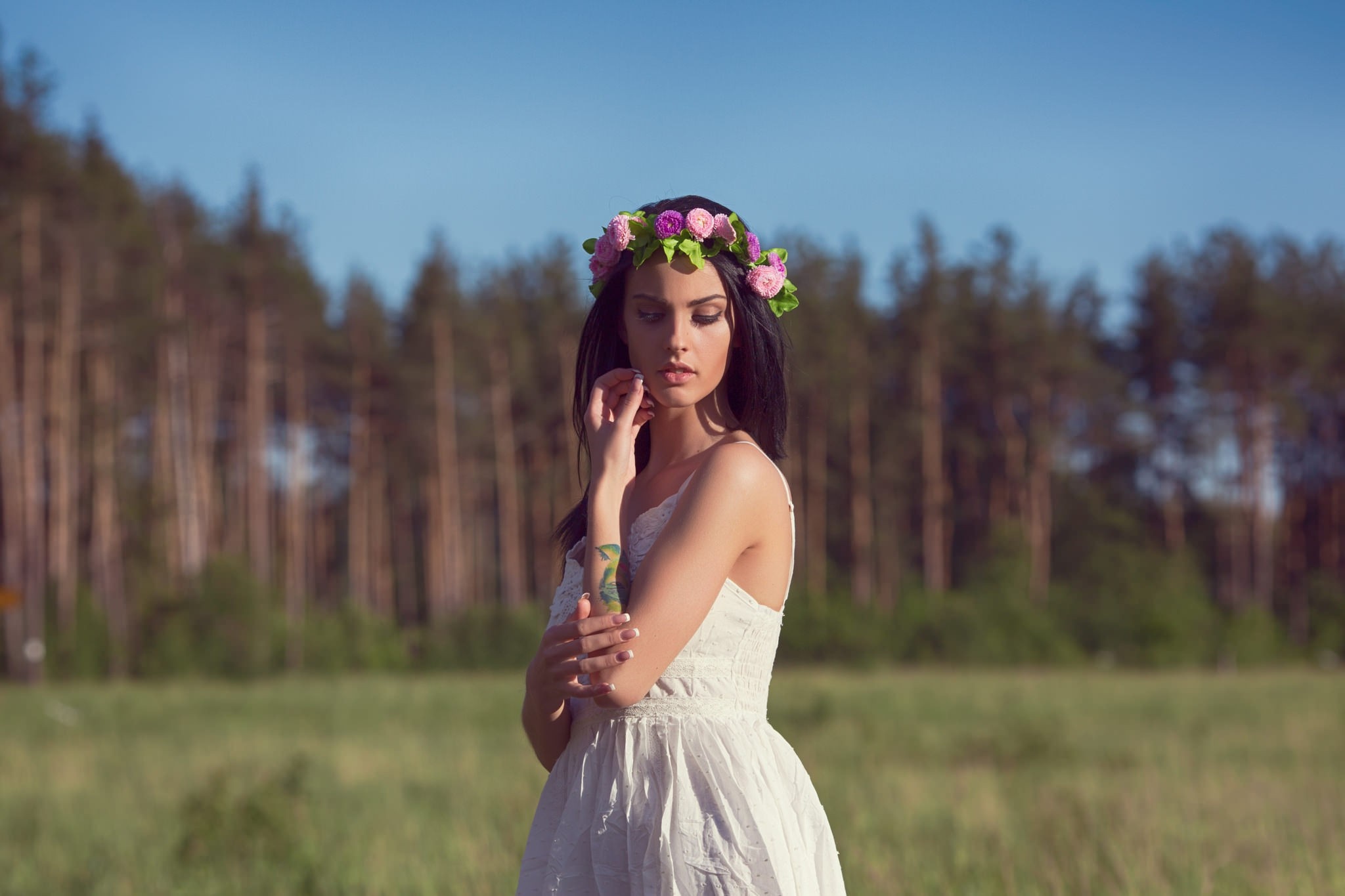 Woman with flower crown in a white dress in a meadow HD Wallpaper