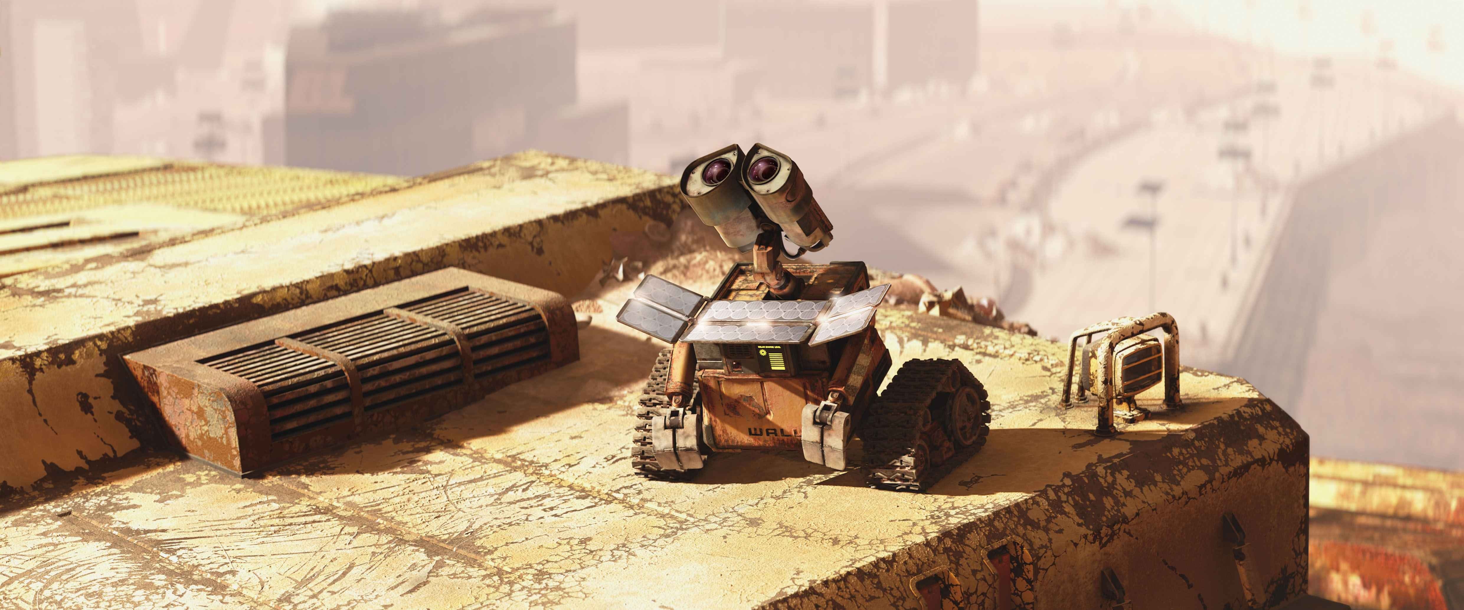 WALL-E robot on a rusty rooftop overlooking a city HD Wallpaper