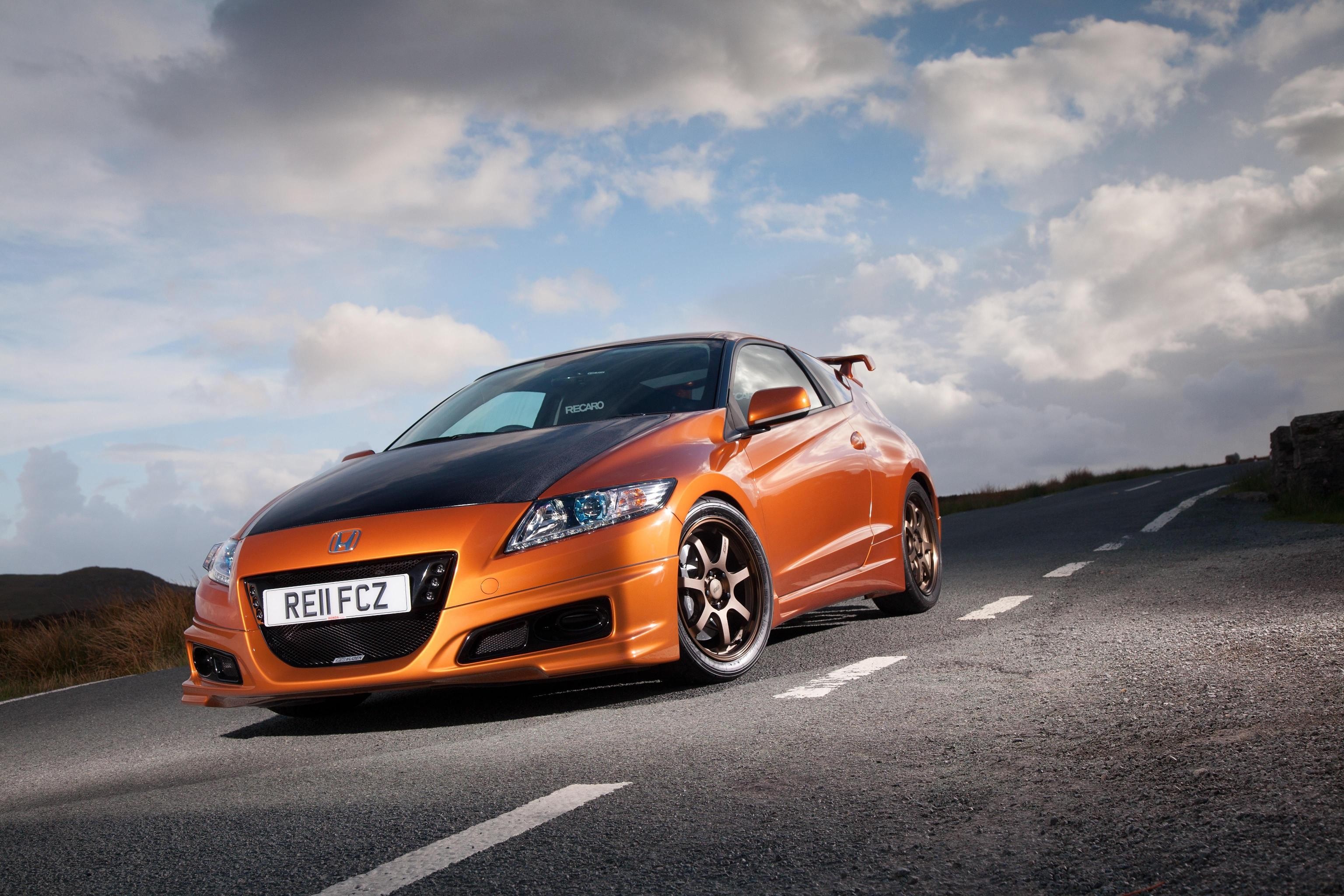 Orange Honda CR-Z sports car on a road HD Wallpaper