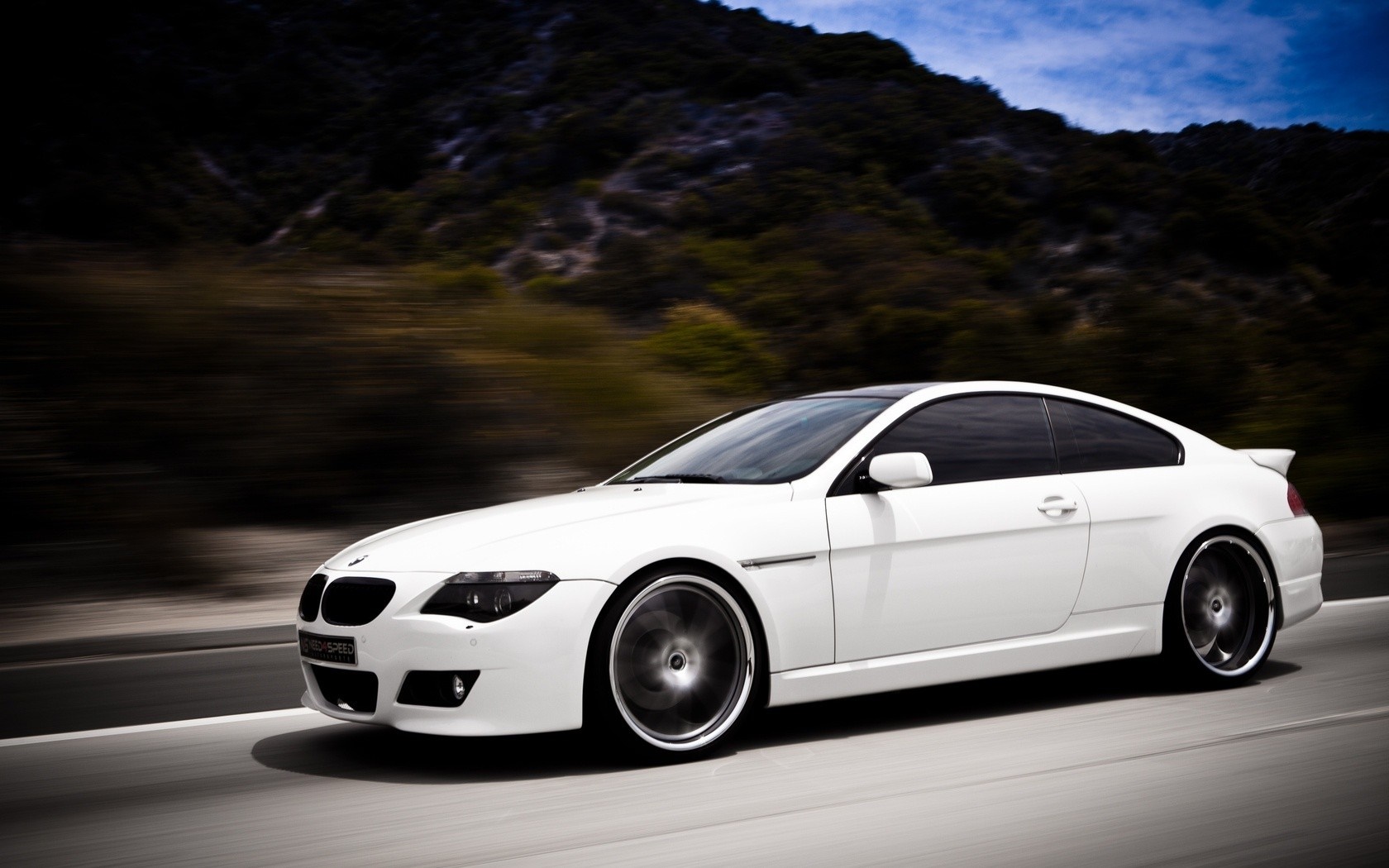 White BMW 6 Series Coupe driving on a road HD Wallpaper