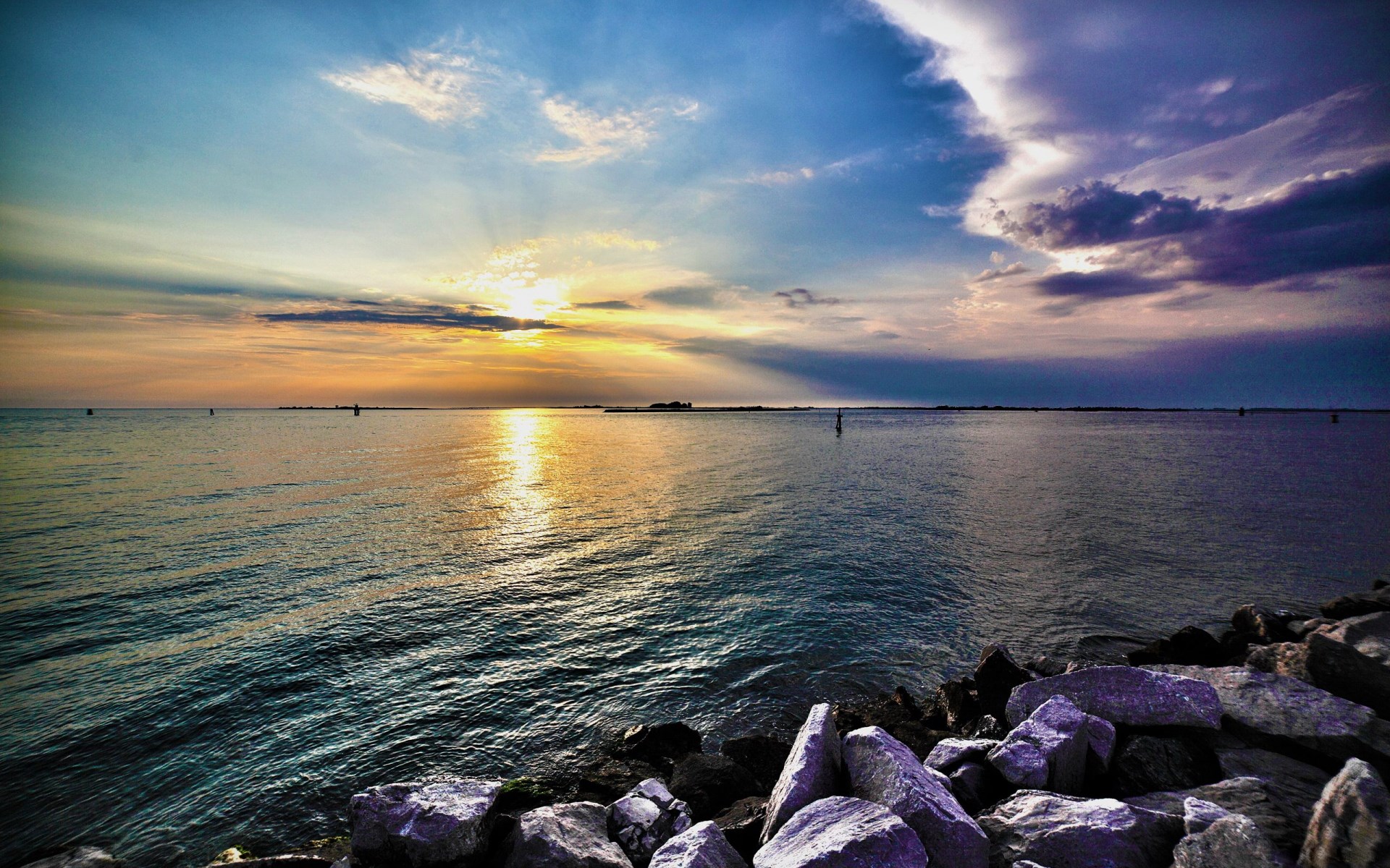Sunset over the ocean with rocks in foreground HD Wallpaper