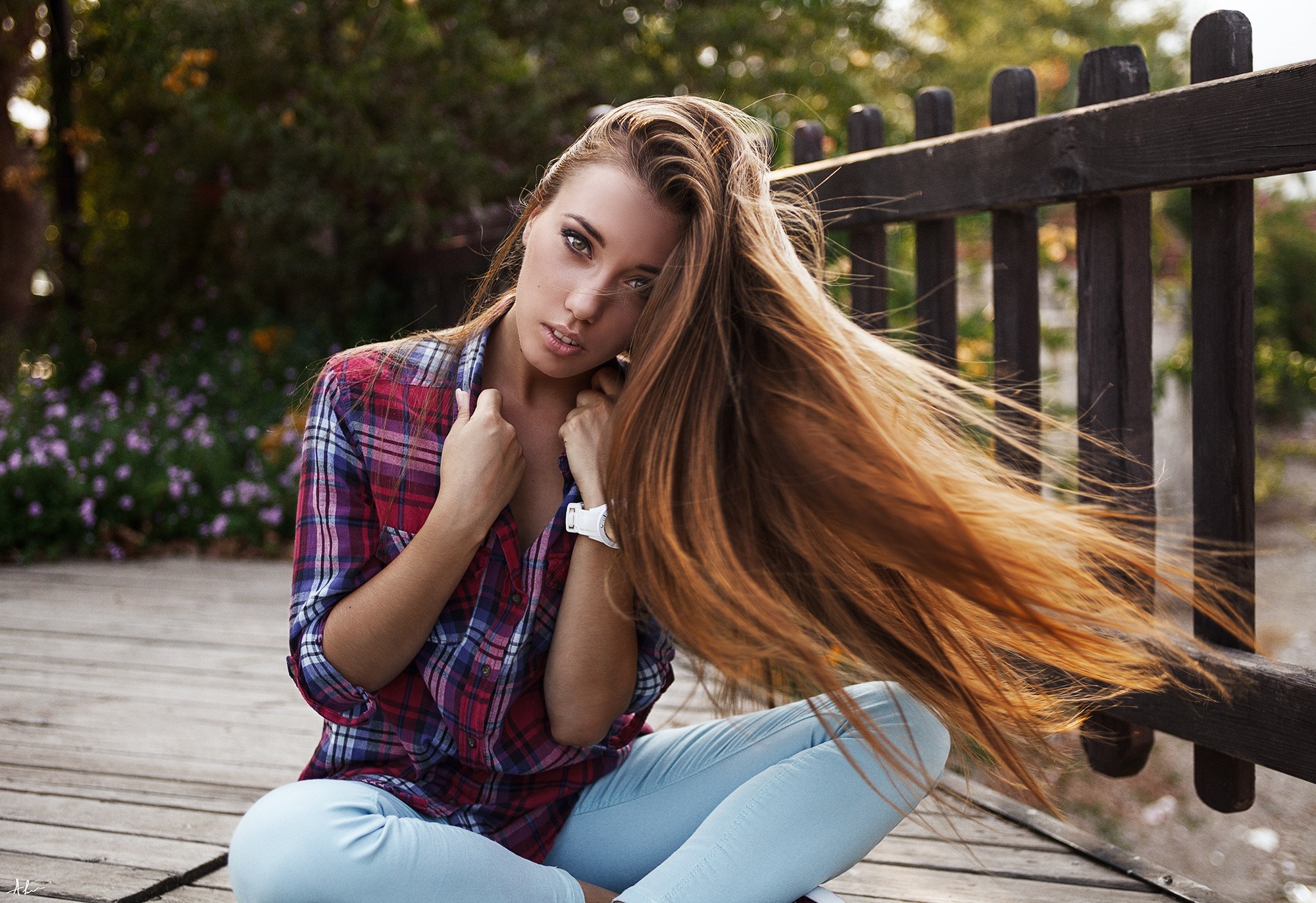 Woman with long brown hair wearing plaid shirt and jeans HD Wallpaper