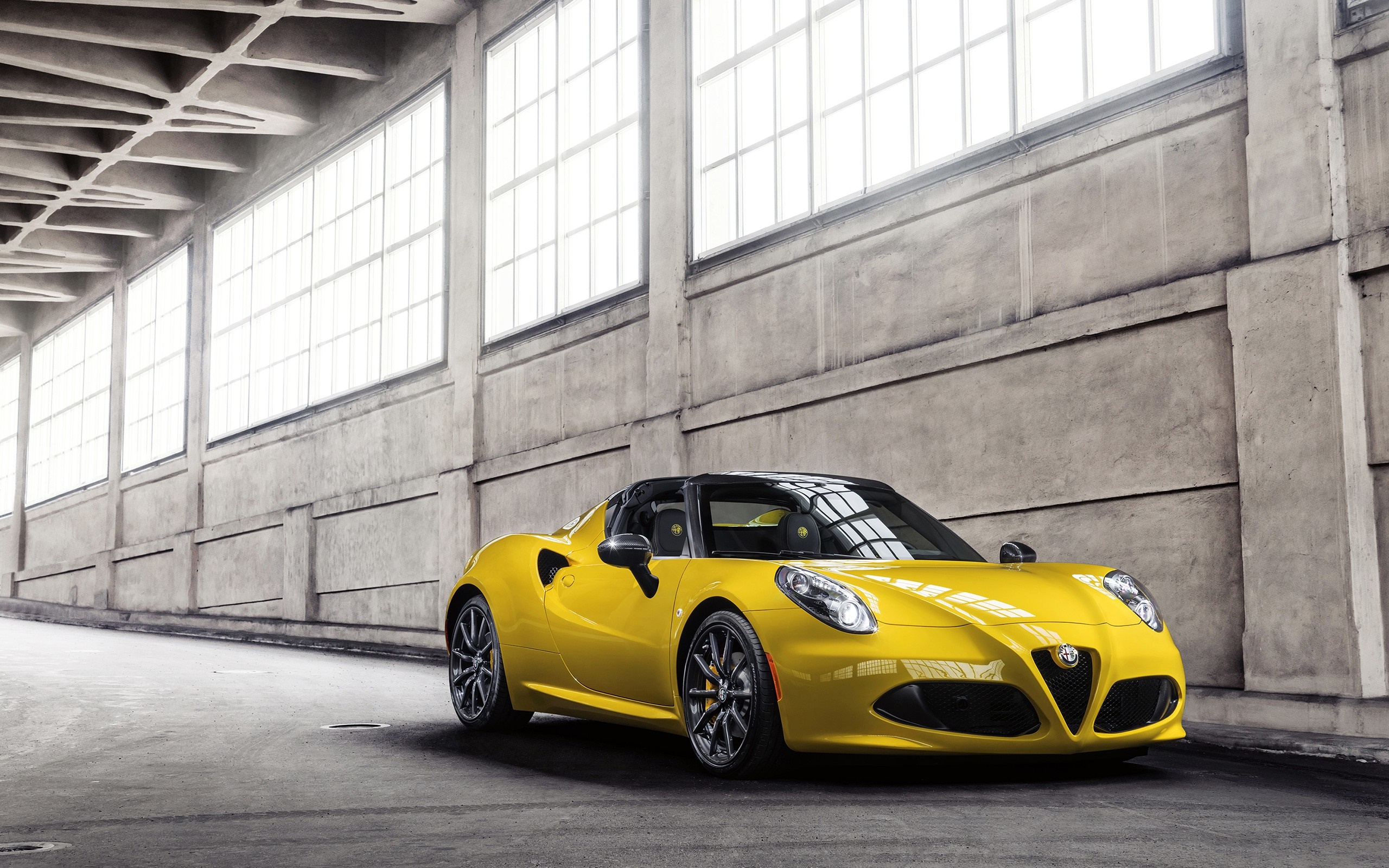 Yellow Alfa Romeo 4C Spider in industrial building HD Wallpaper
