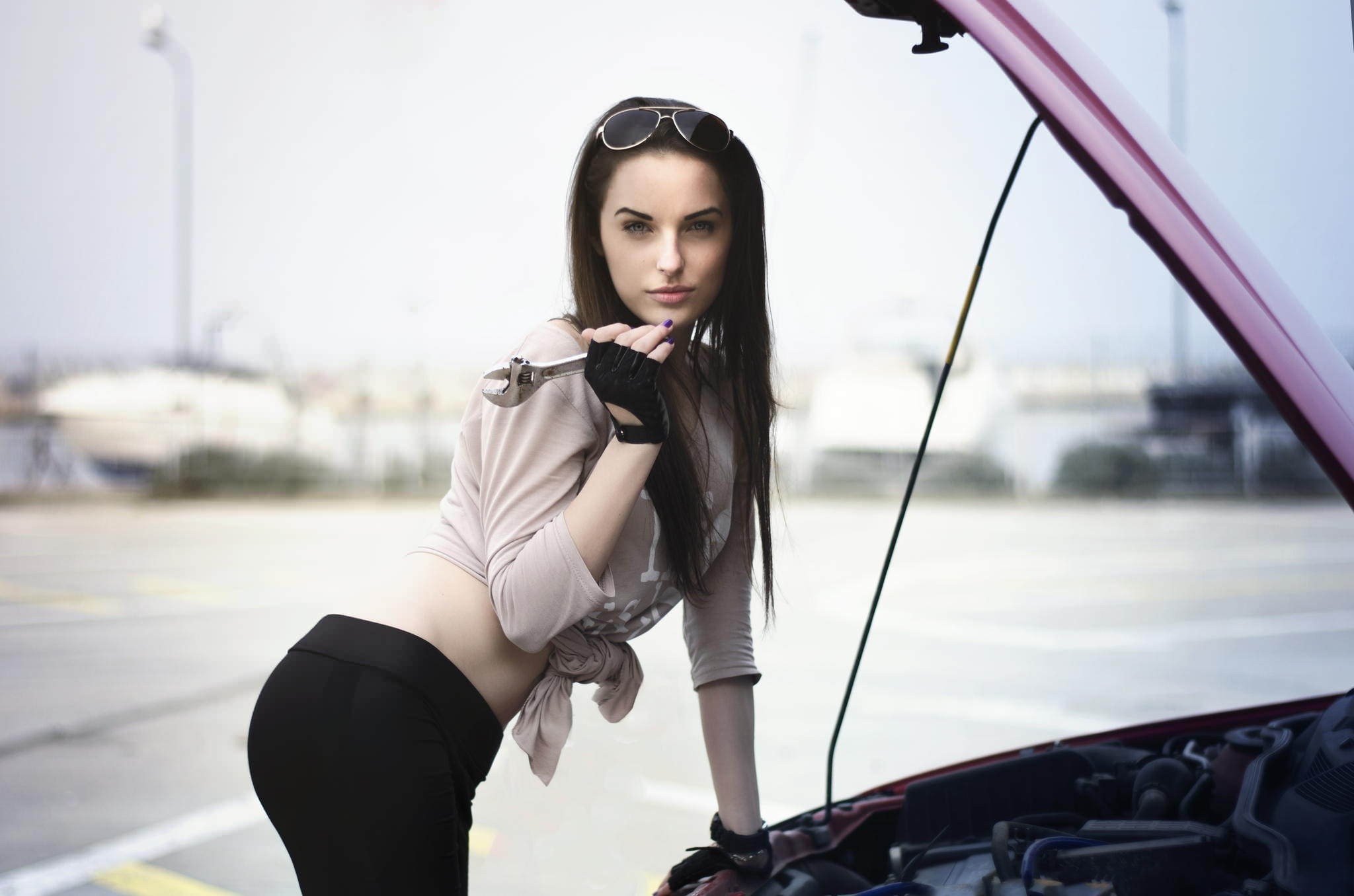 Woman with wrench by car engine HD Wallpaper