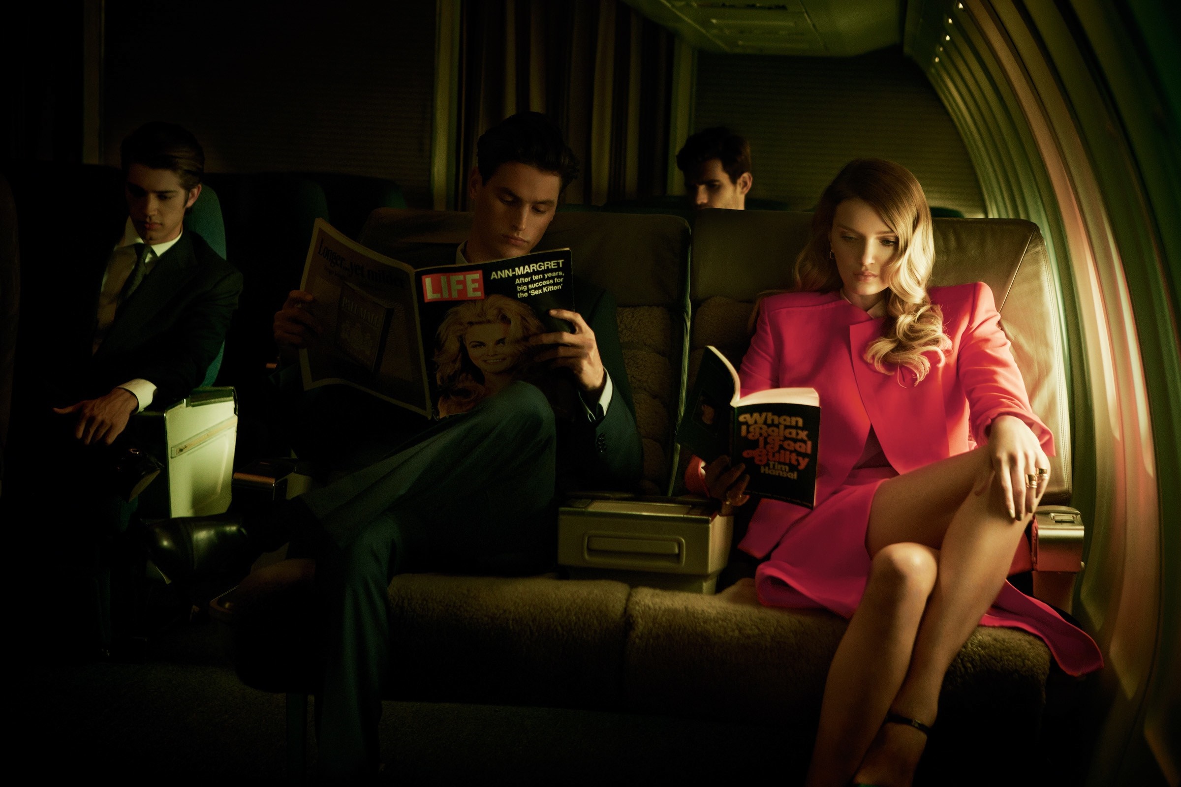 People reading on a vintage airplane HD Wallpaper