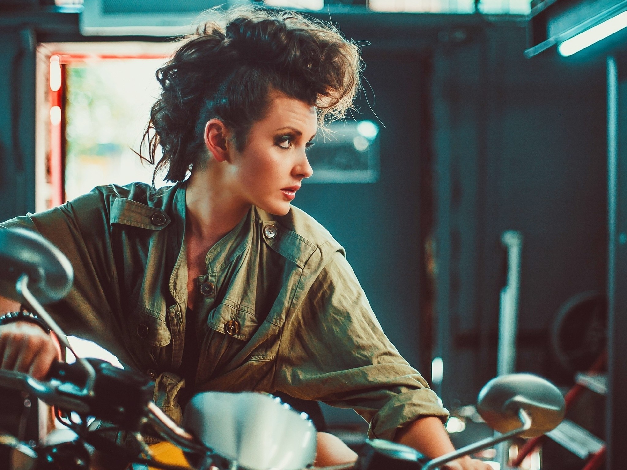 Woman with mohawk sitting on a motorcycle HD Wallpaper