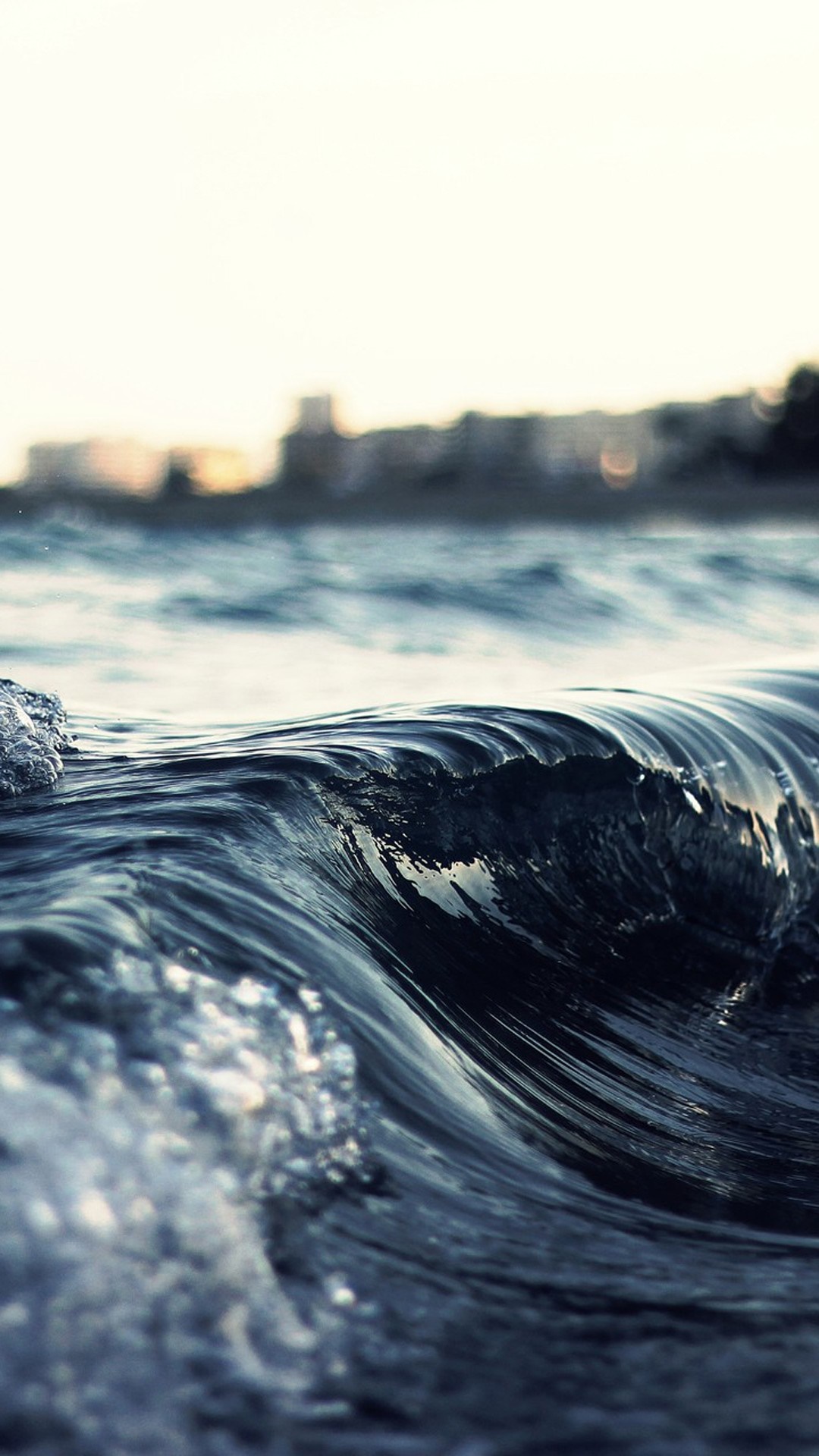 Close up of a dark ocean wave at sunset HD Wallpaper