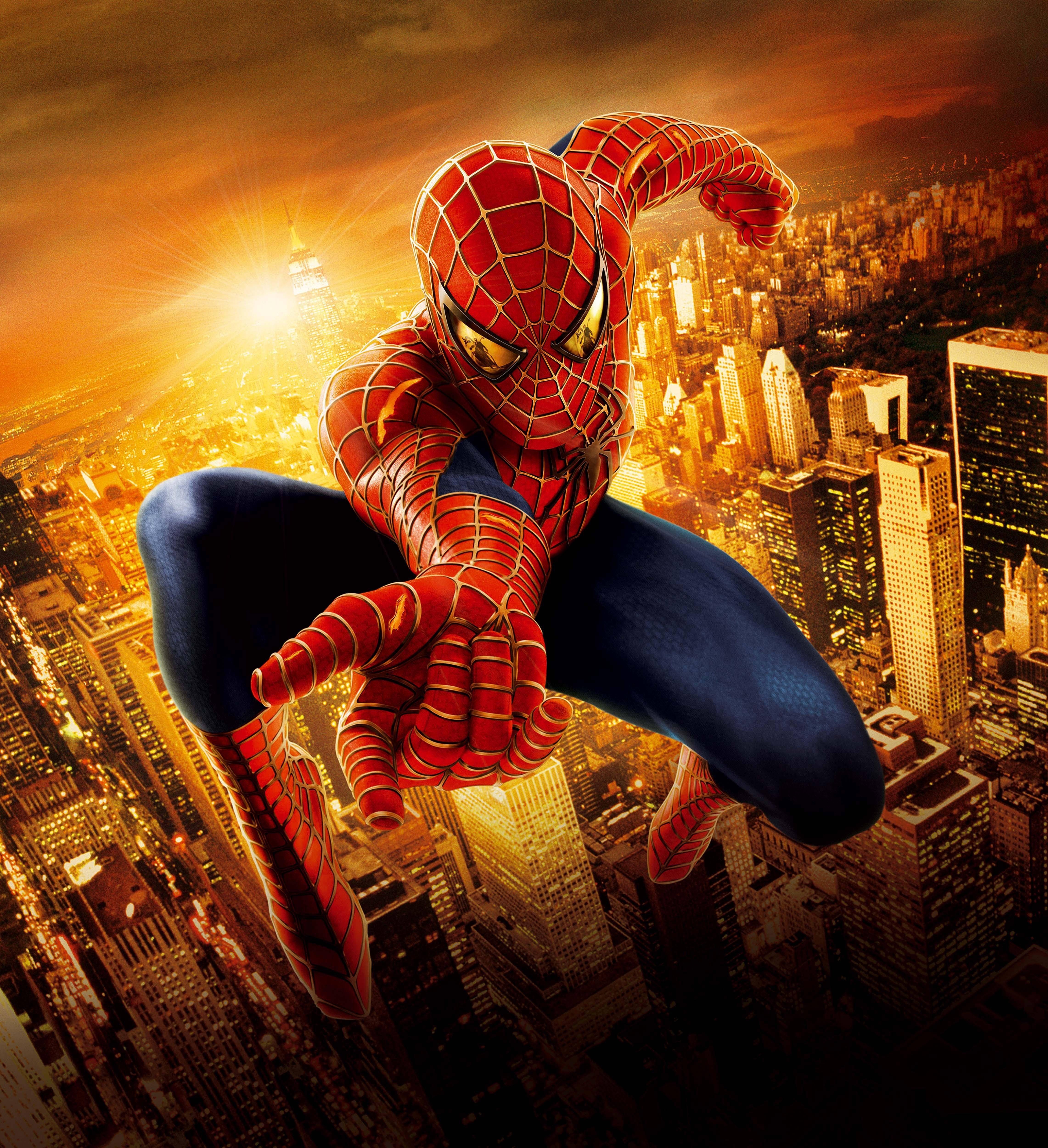 Spider-Man leaping over a city at sunset HD Wallpaper