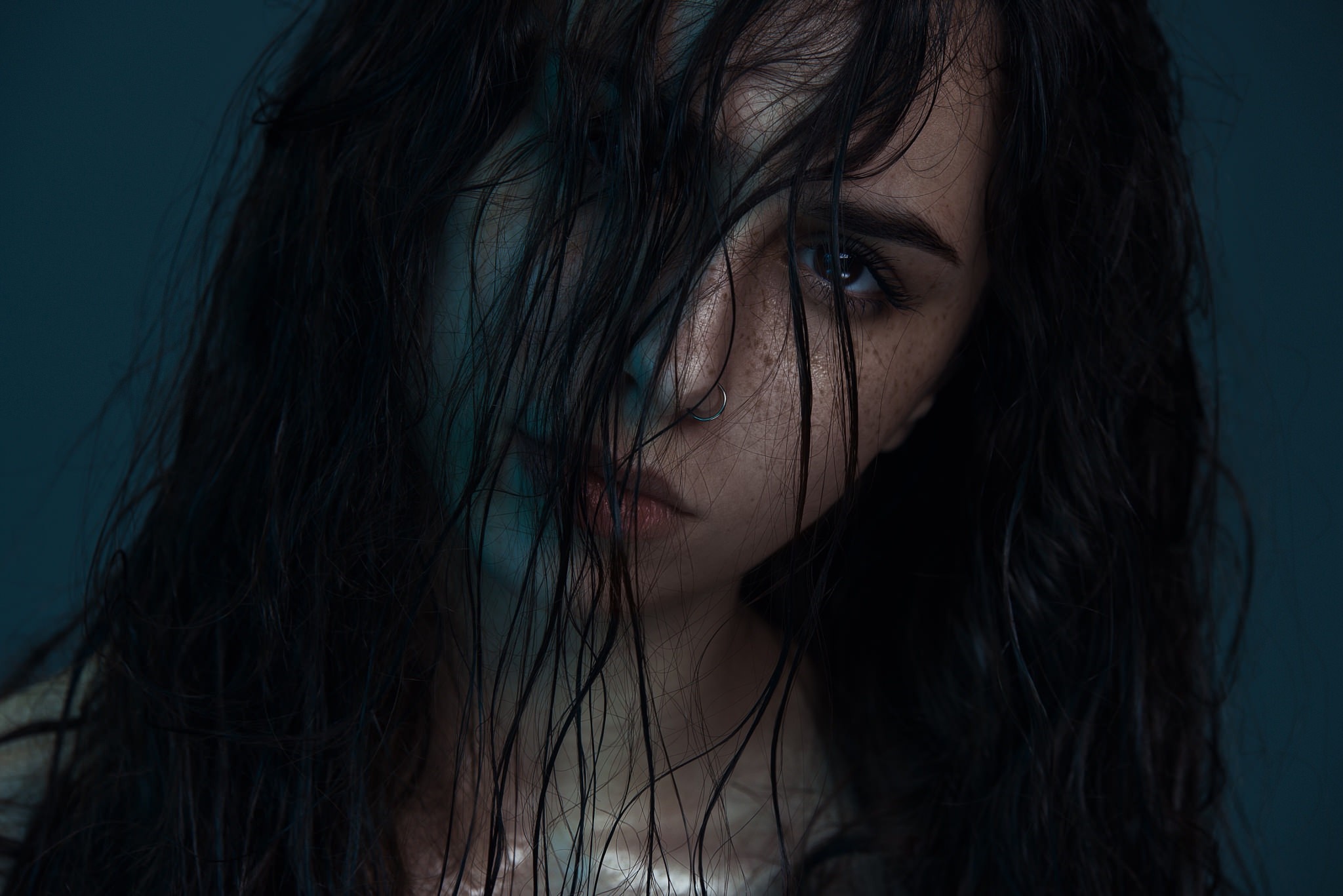 Woman with wet black hair and freckles HD Wallpaper