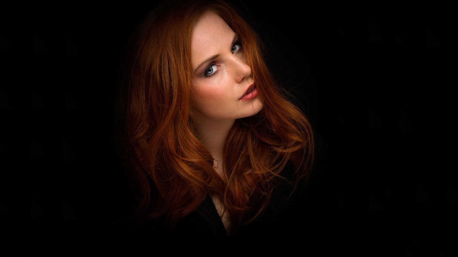 Redheaded Woman with Flowing Hair Against Black HD Wallpaper