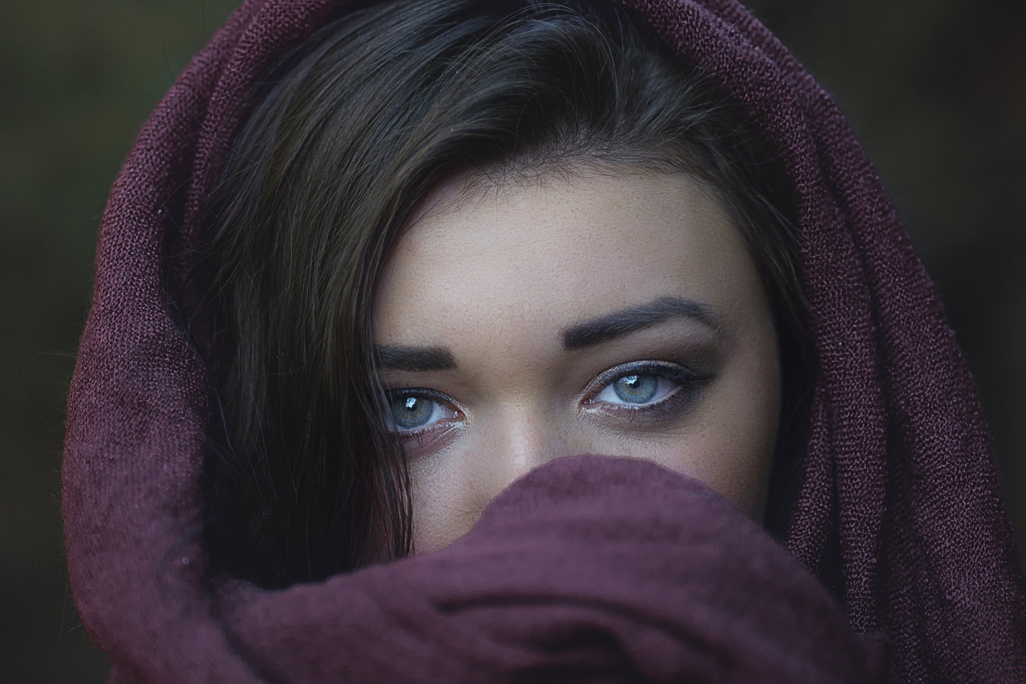 Woman with blue eyes and dark hair wearing a purple scarf HD Wallpaper