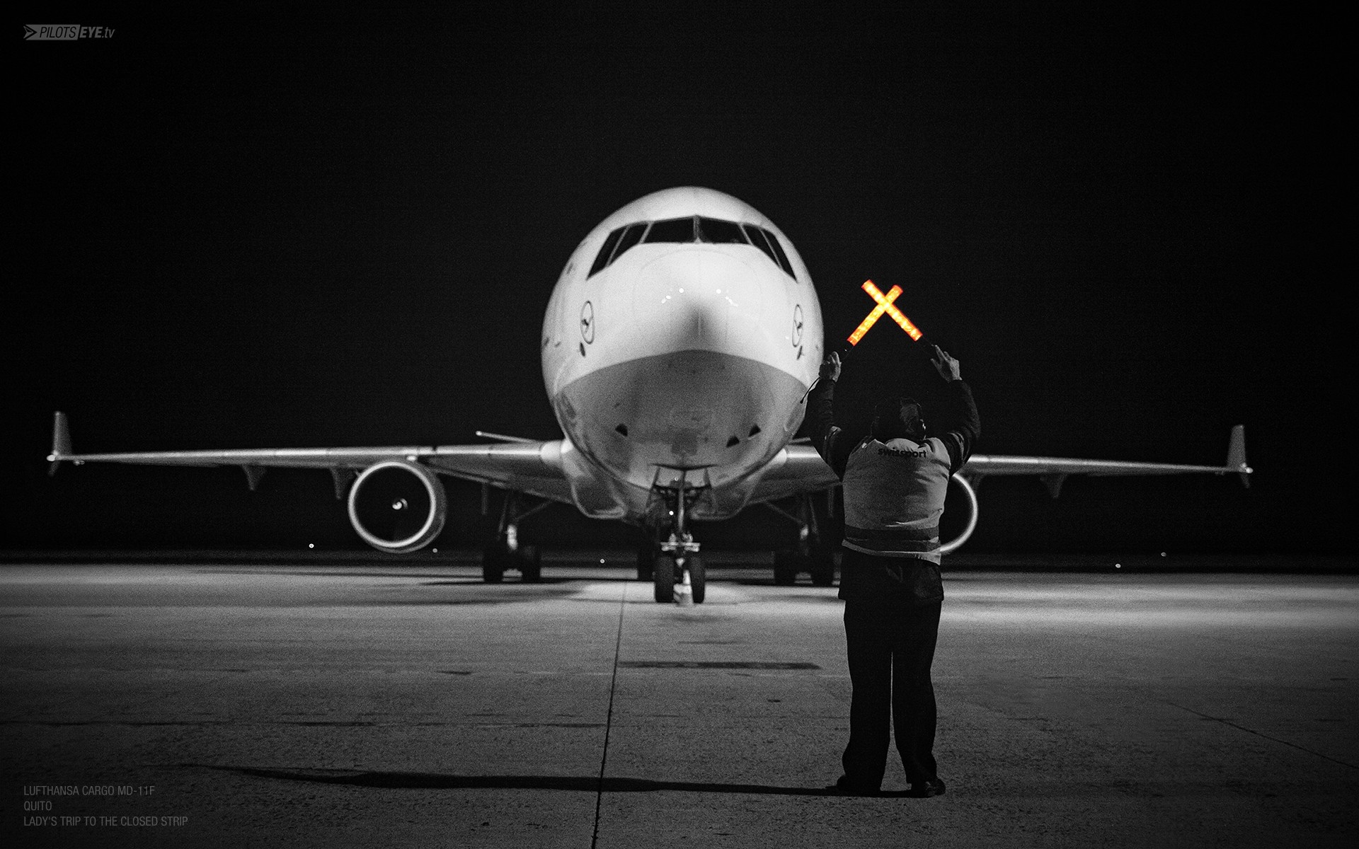 Lufthansa Cargo MD-11F marshaller at night HD Wallpaper